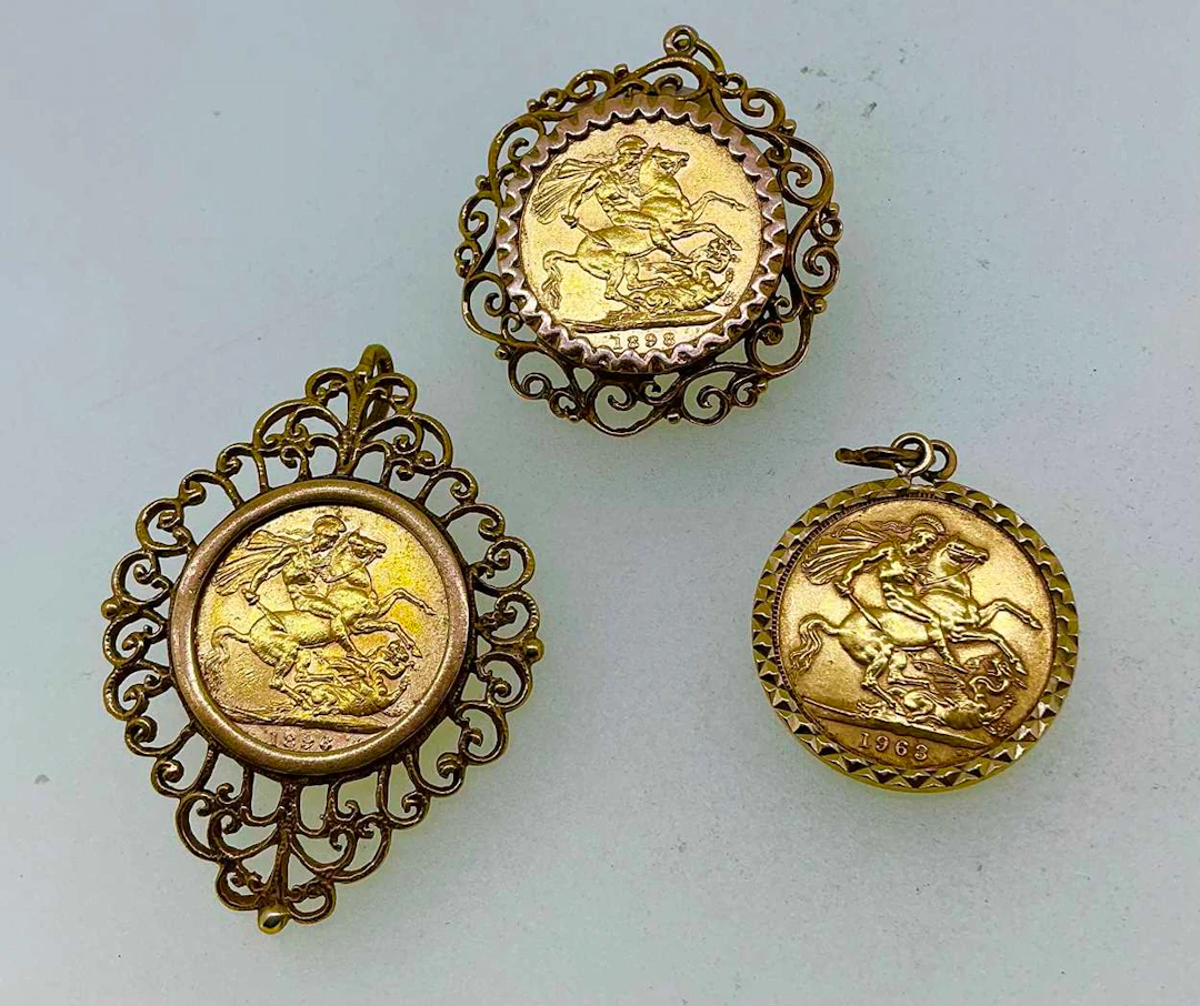 Three full sovereign pendants