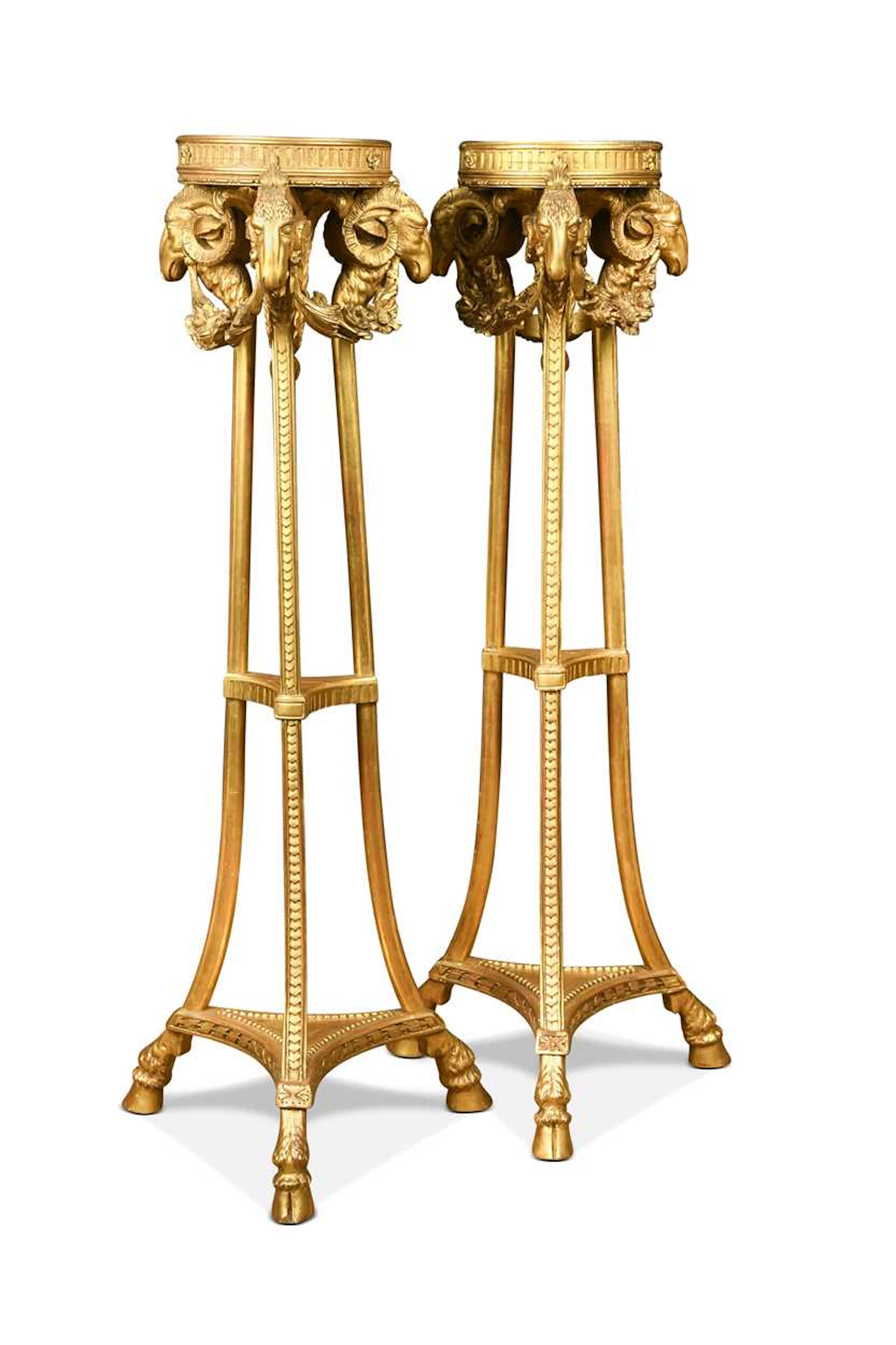 A pair of Neoclassical style carved giltwood torchères, 19th century