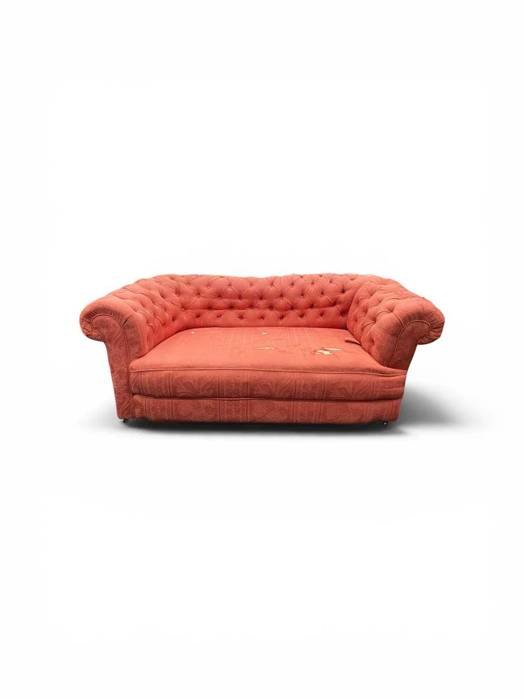 A small two seat Chesterfield sofa