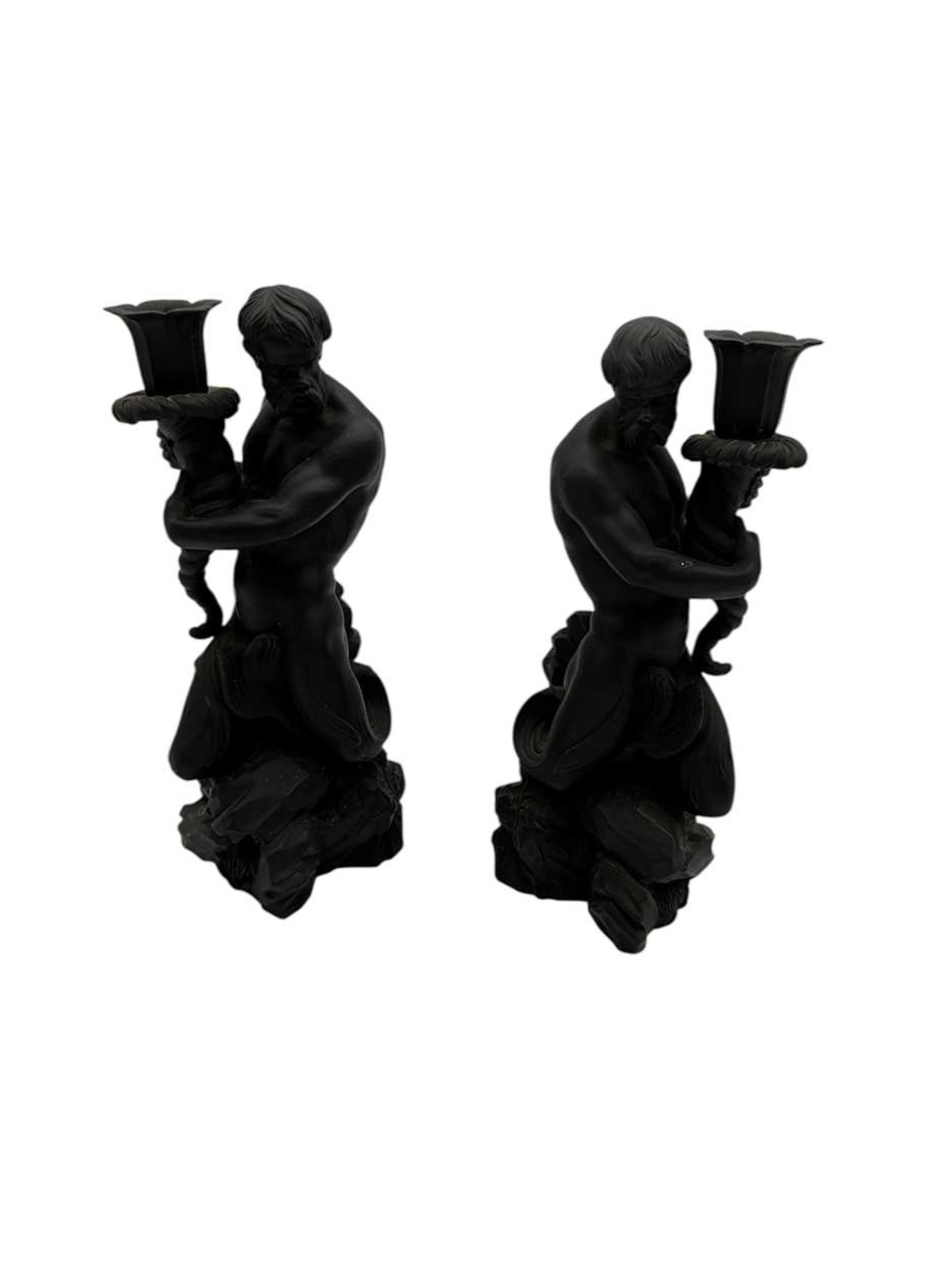 A pair of Wedgwood black basalt triton candlesticks