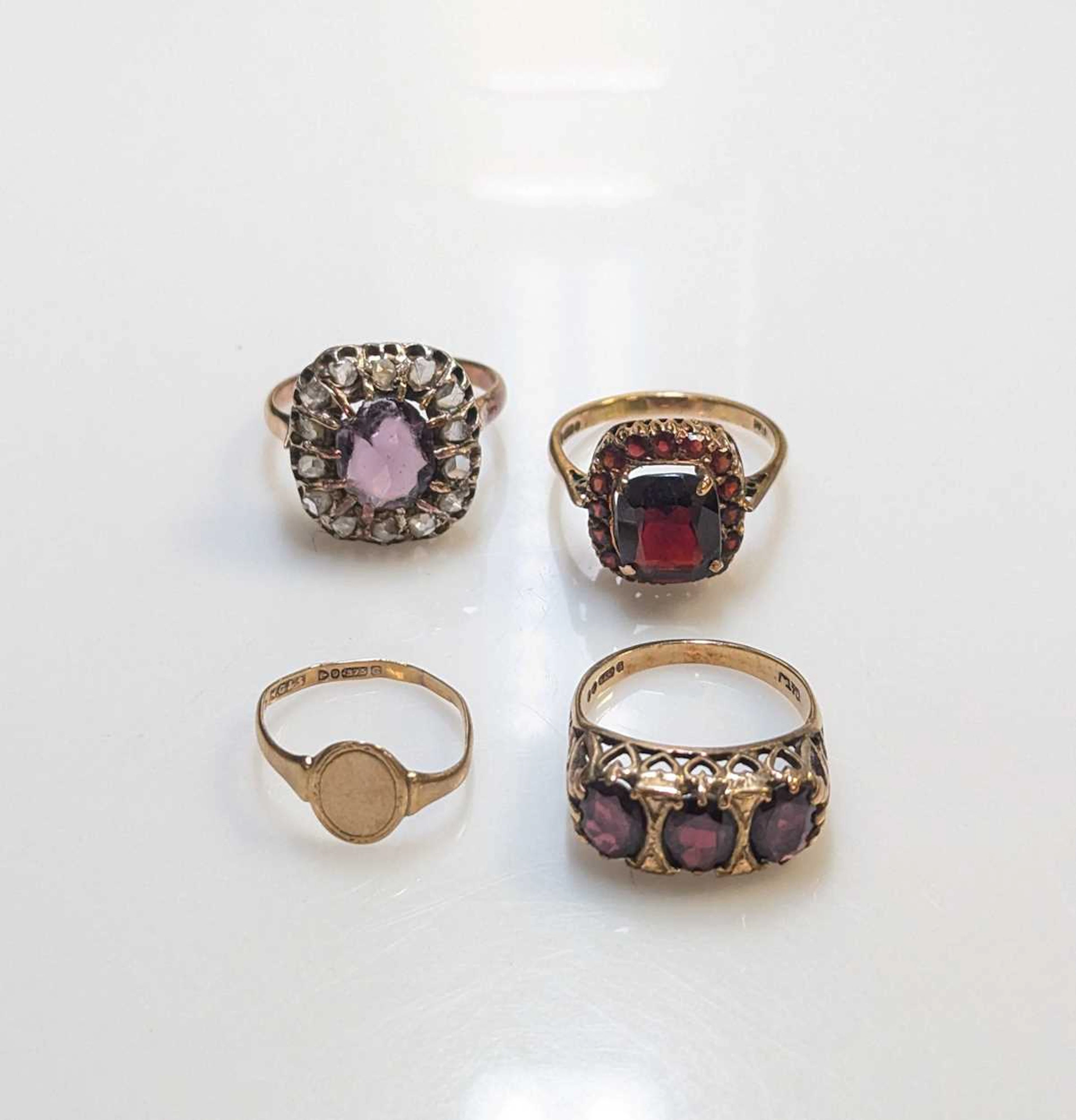 A purple paste and diamond cluster ring