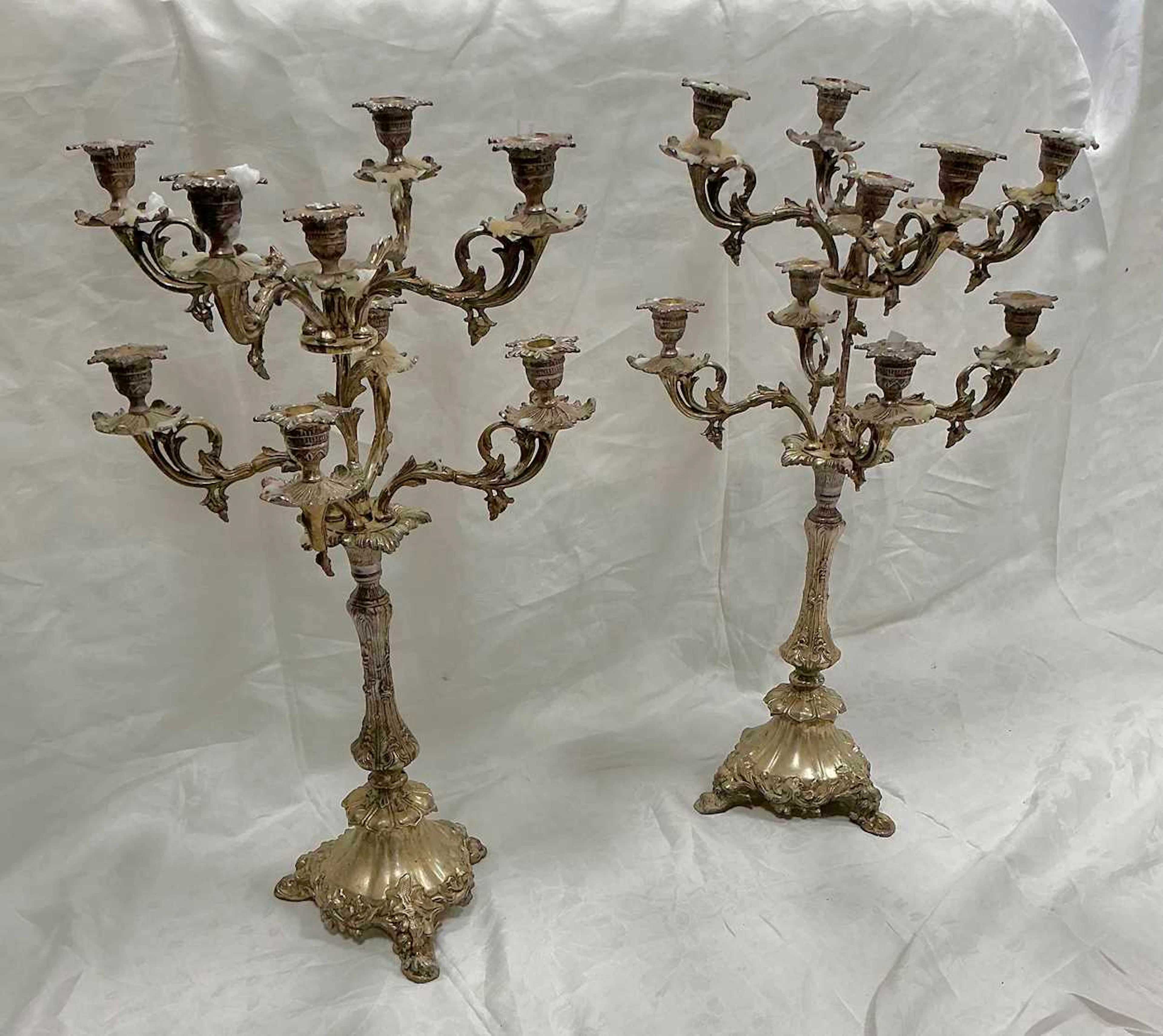 A pair of silver plated nine branch candelabra 79cm high (2)