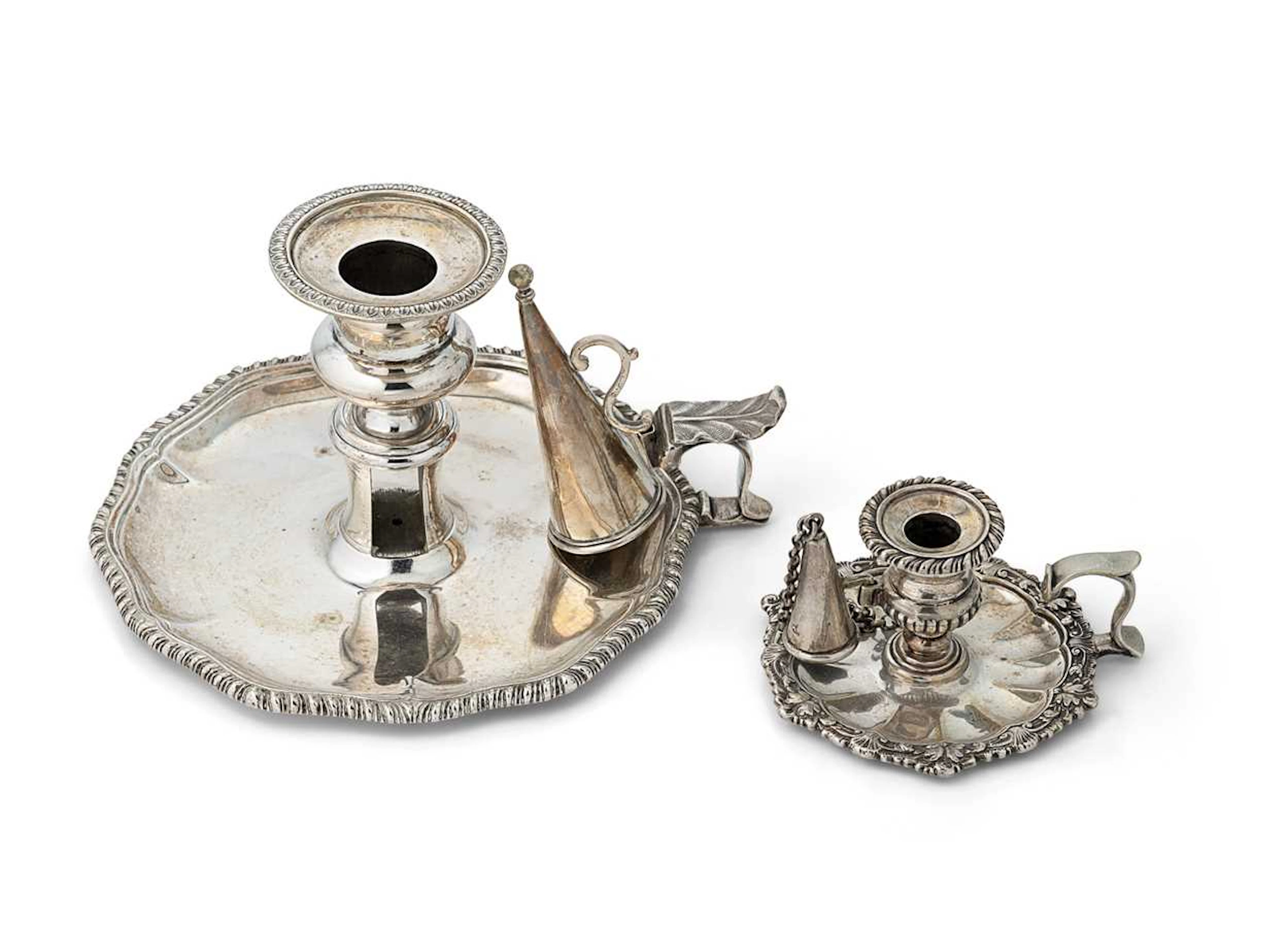 A George III chamberstick, along with another