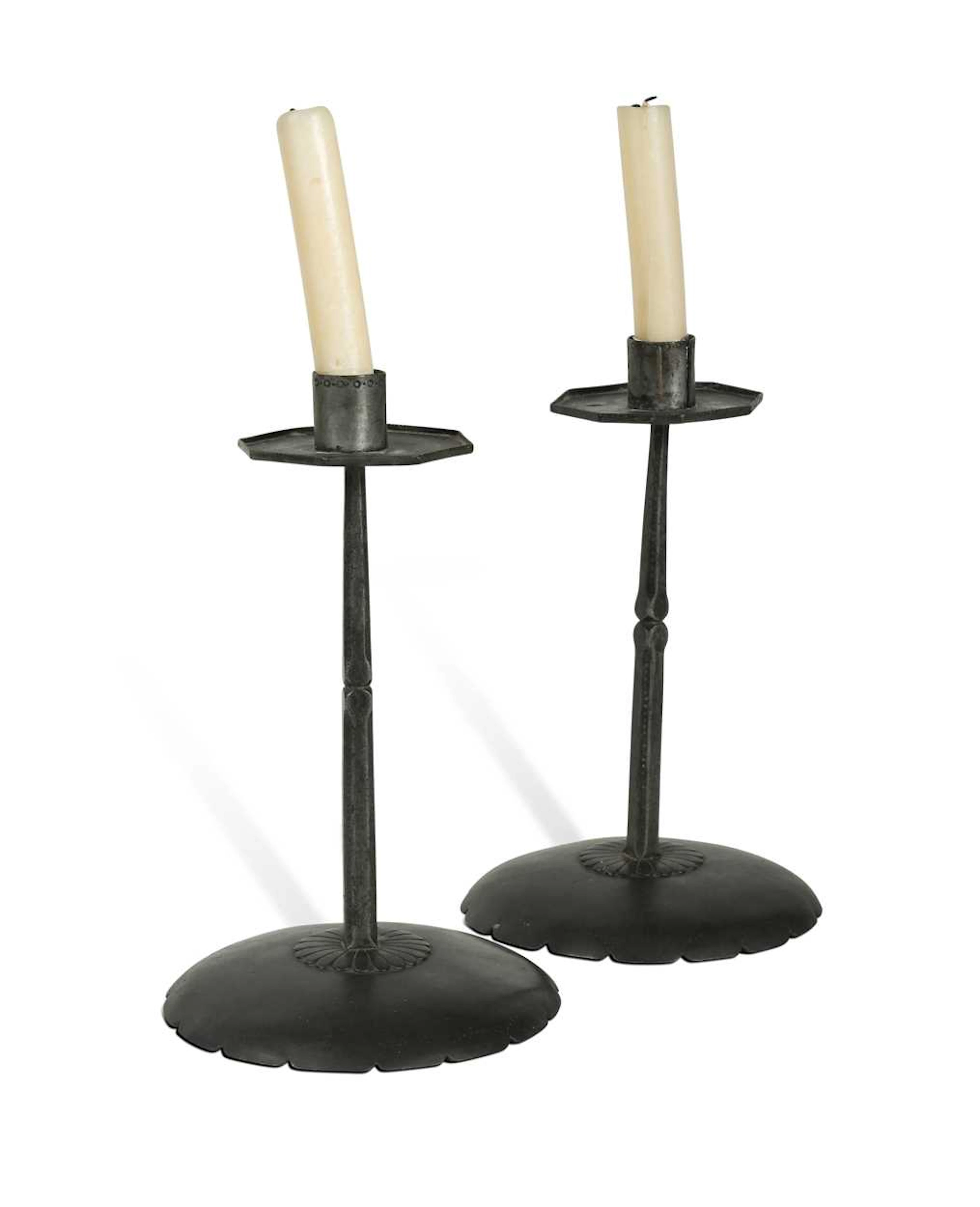 Ernest Gimson (1864-1919), a pair of steel candlesticks made by Alfred