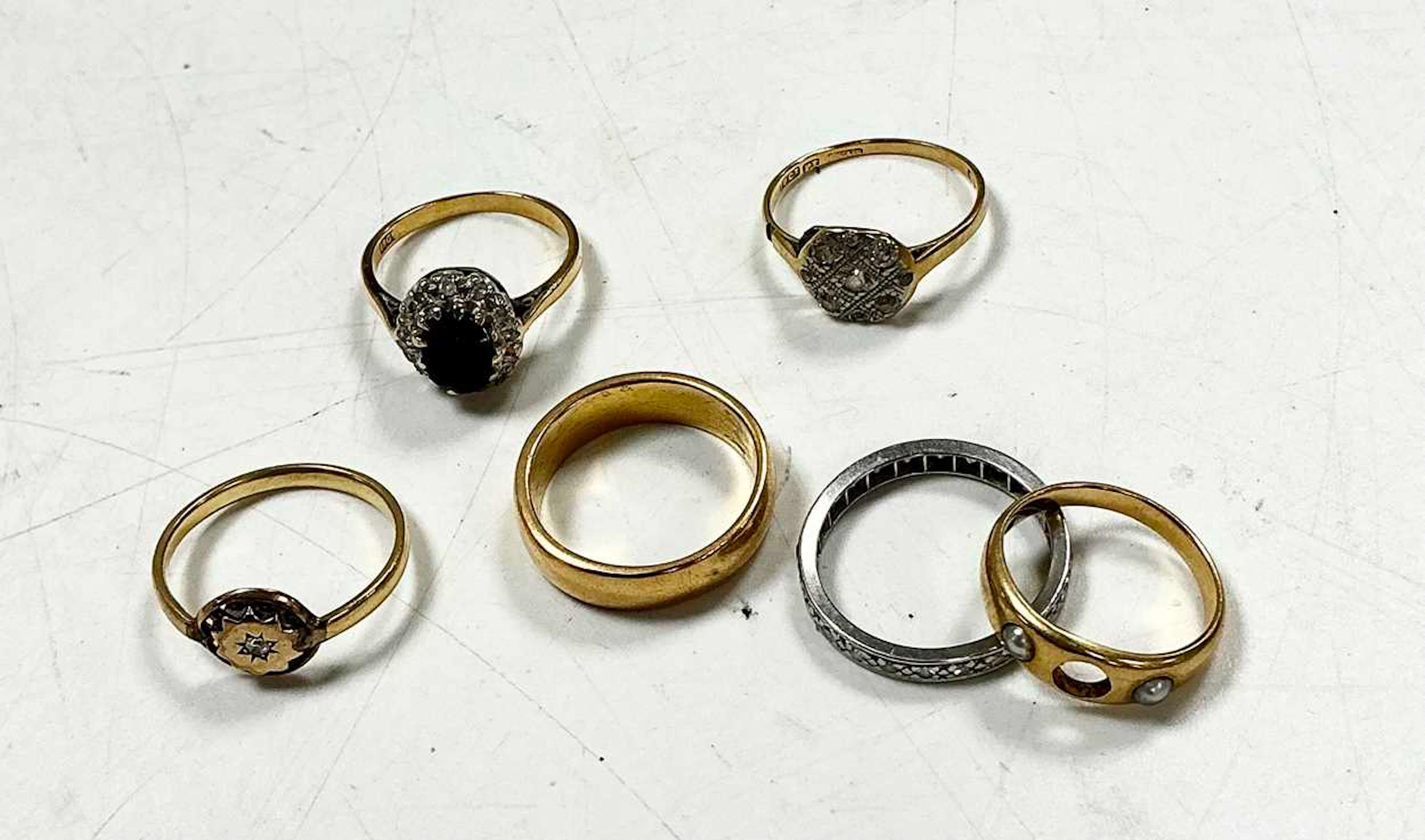 Five rings assessed as 18ct gold