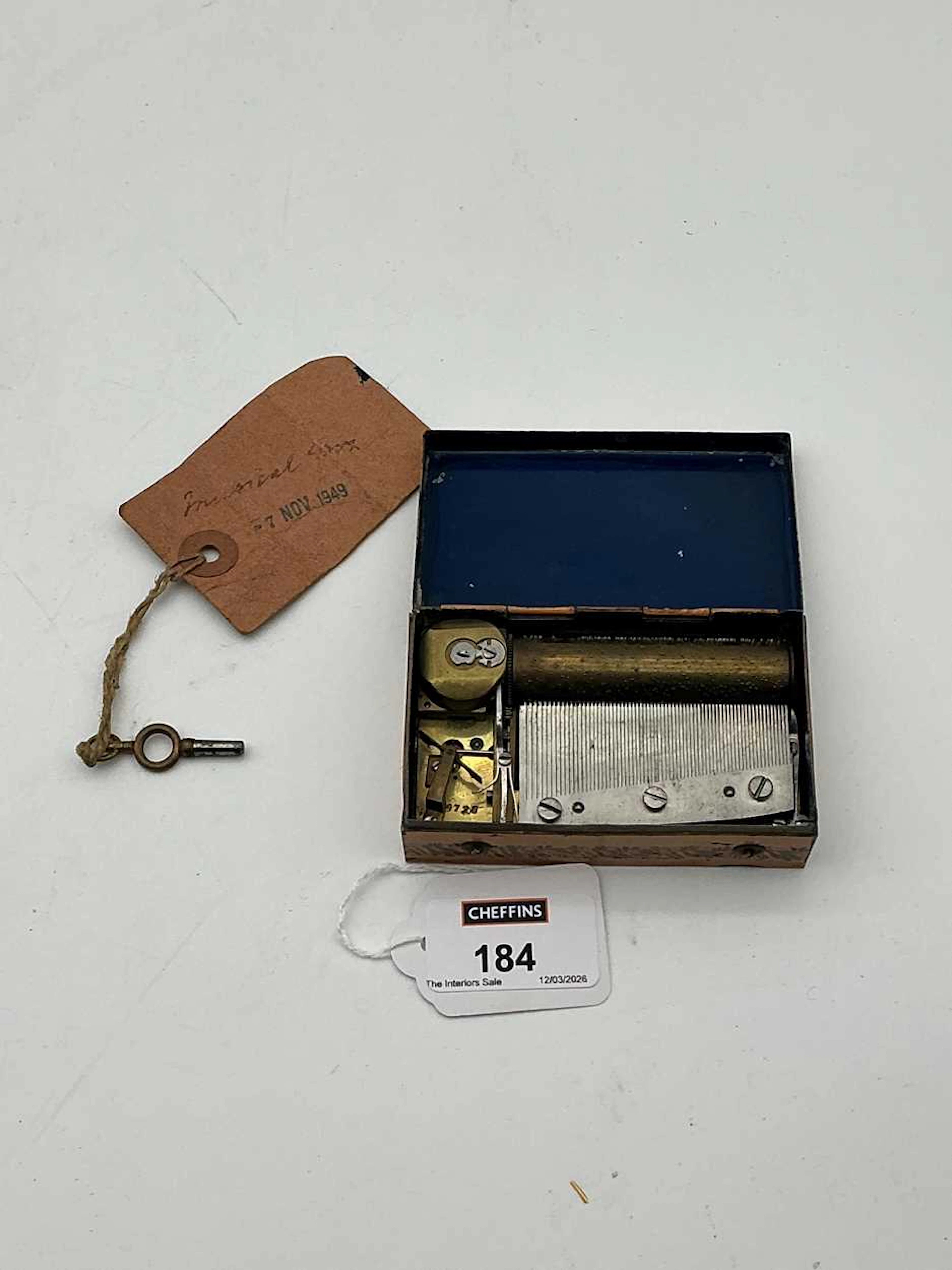 A miniature Swiss musical box with printed lake-landscape lid