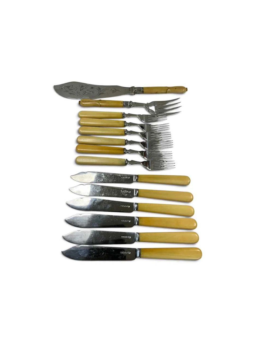 A set of six George III berry spoons; a set of six fish...