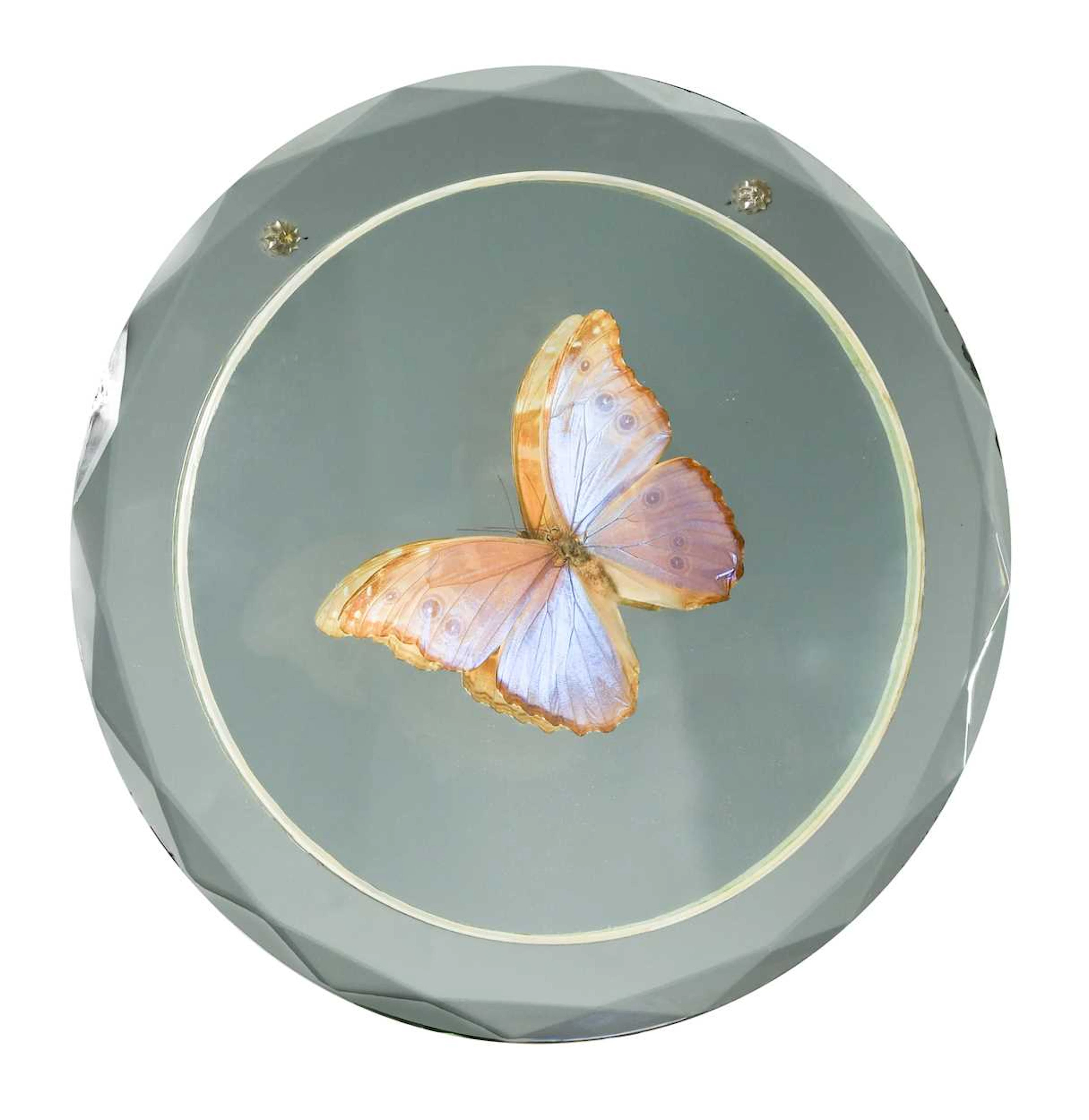 A mid-century butterfly wall mirror