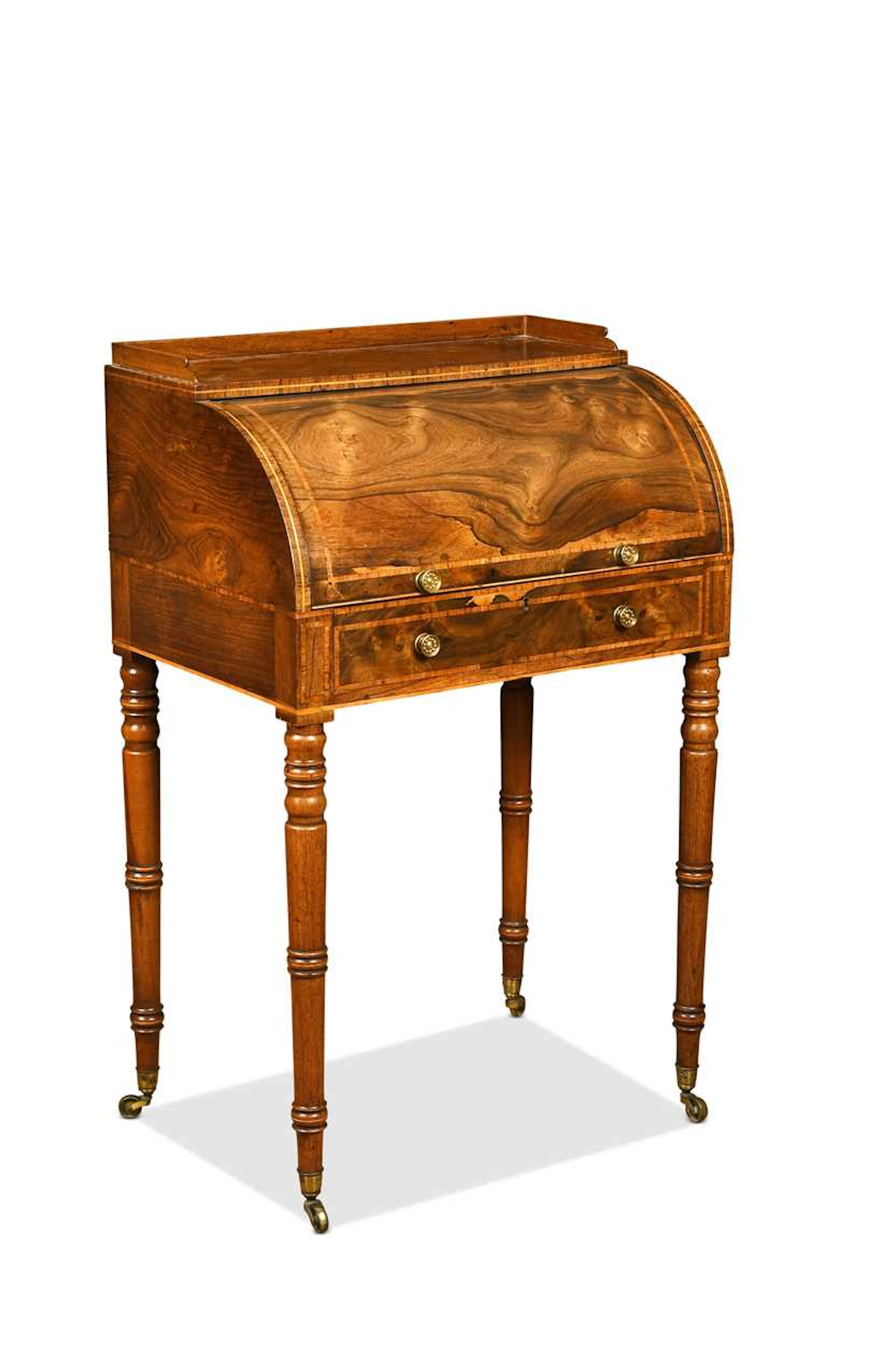 A small rosewood and crossbanded cylinder desk, early 19th century