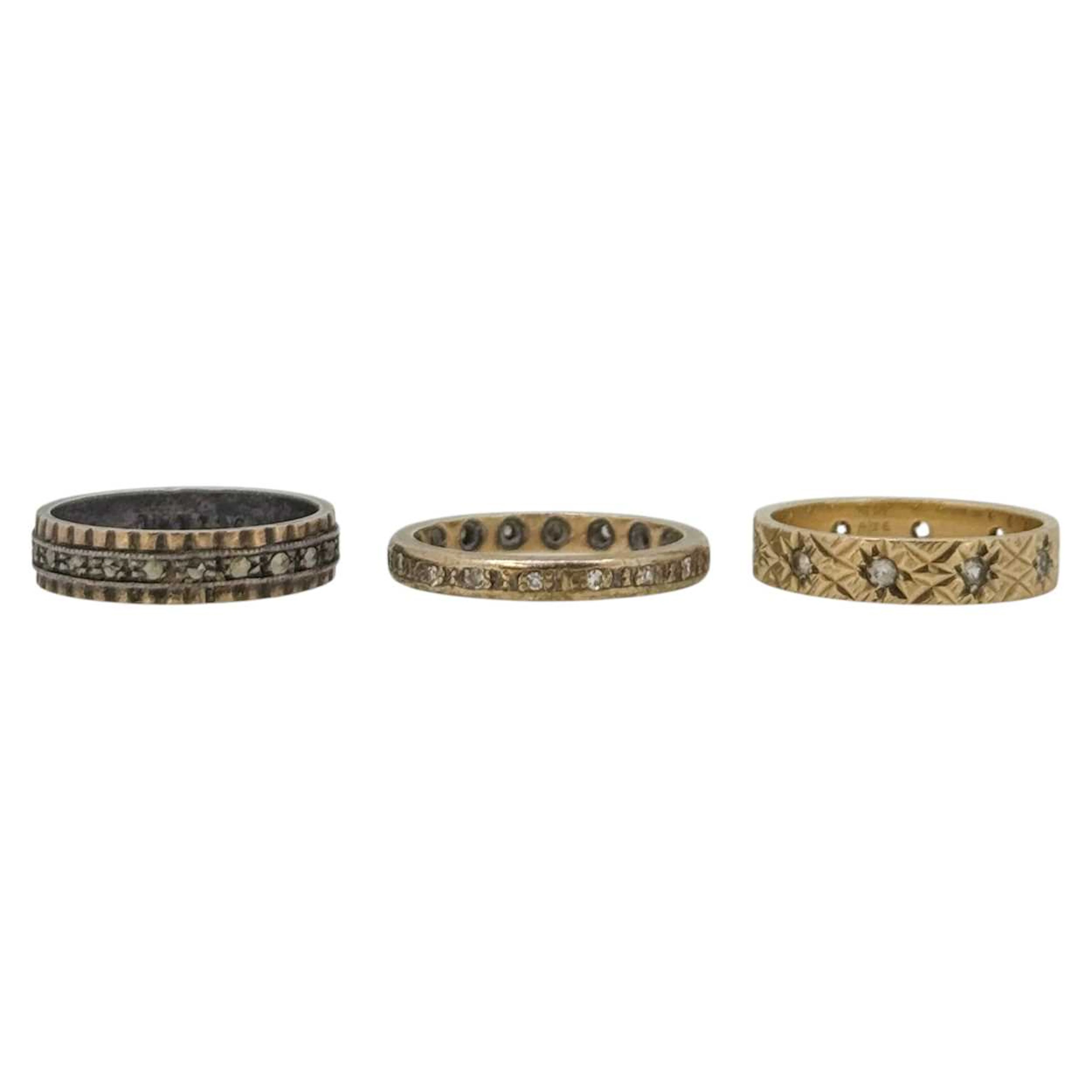 A trio of stone set rings
