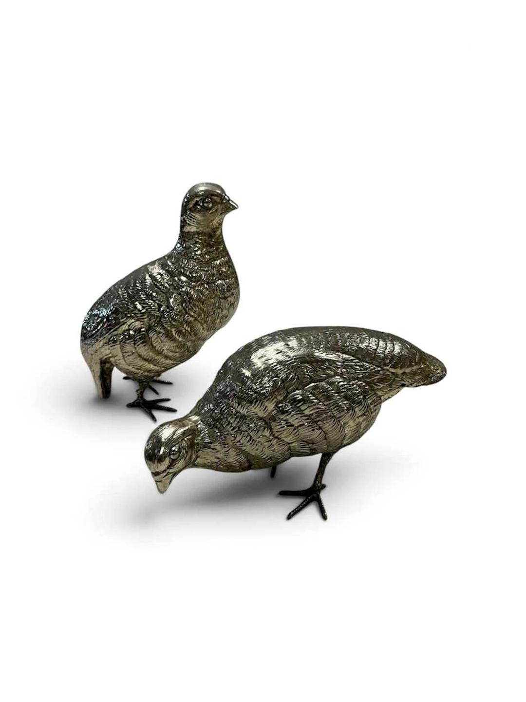 A pair of EPNS models of partridges; a small EPNS model...