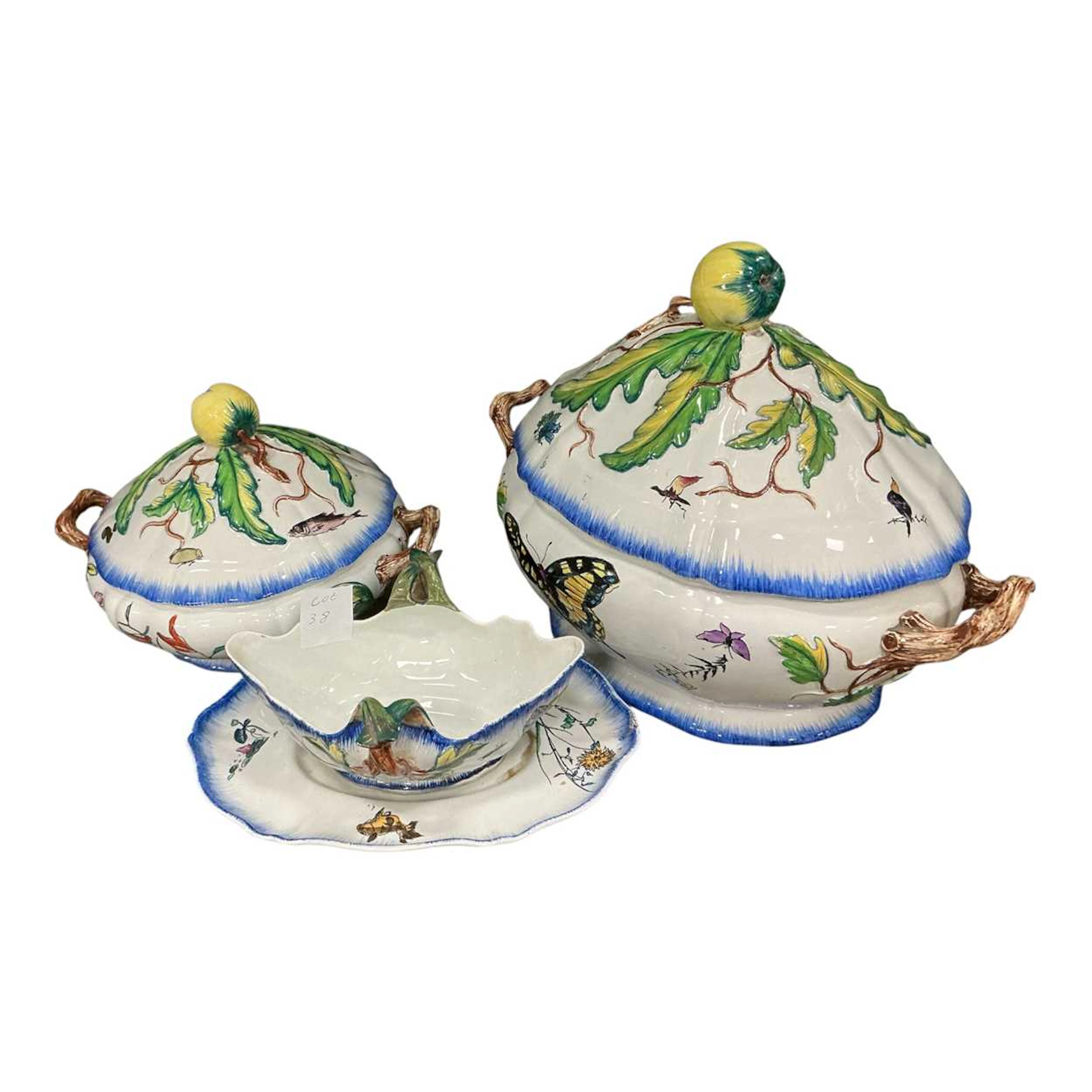 Two French faience pottery tureens and covers and a sauceboat