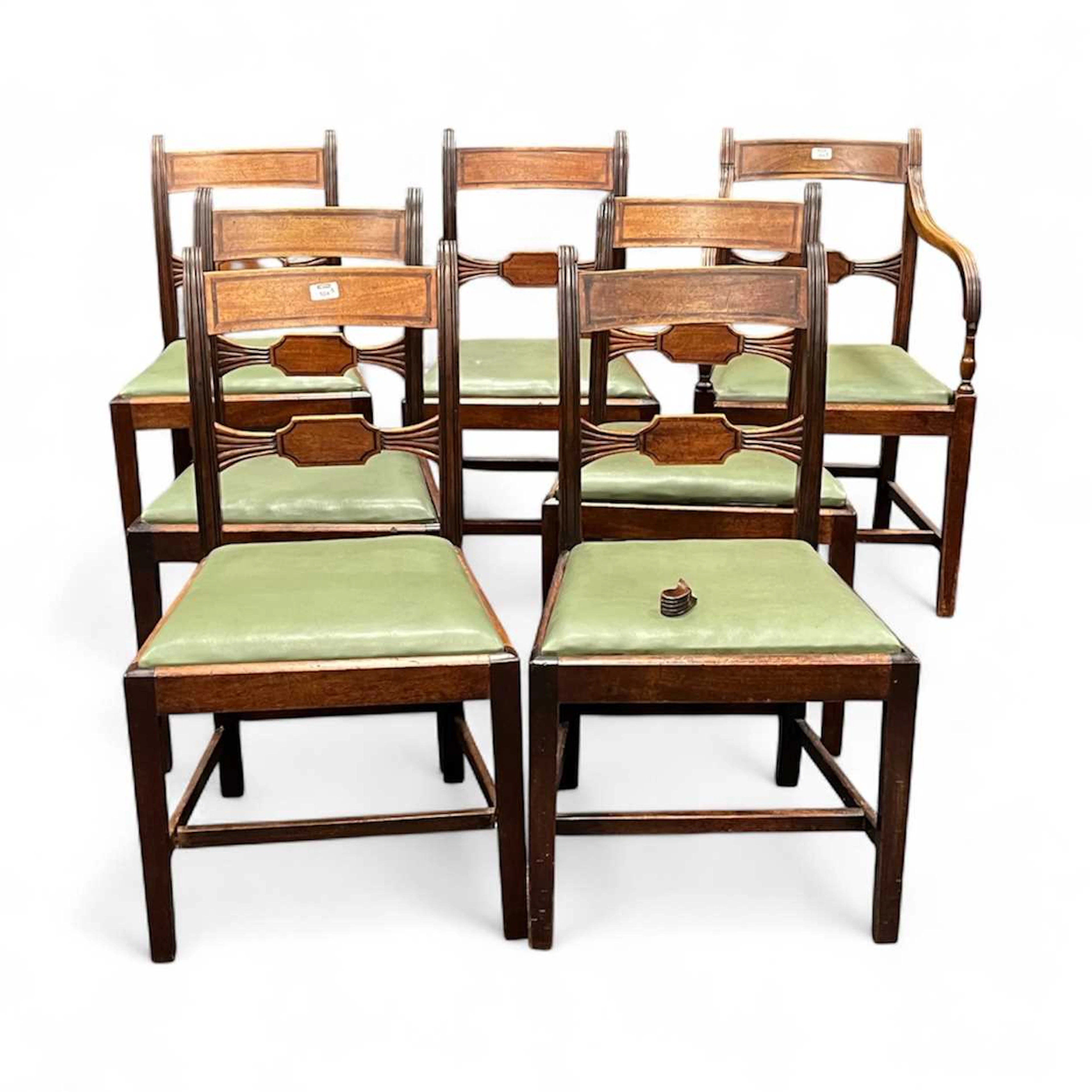 A set of seven Regency mahogany bar back dining chairs...