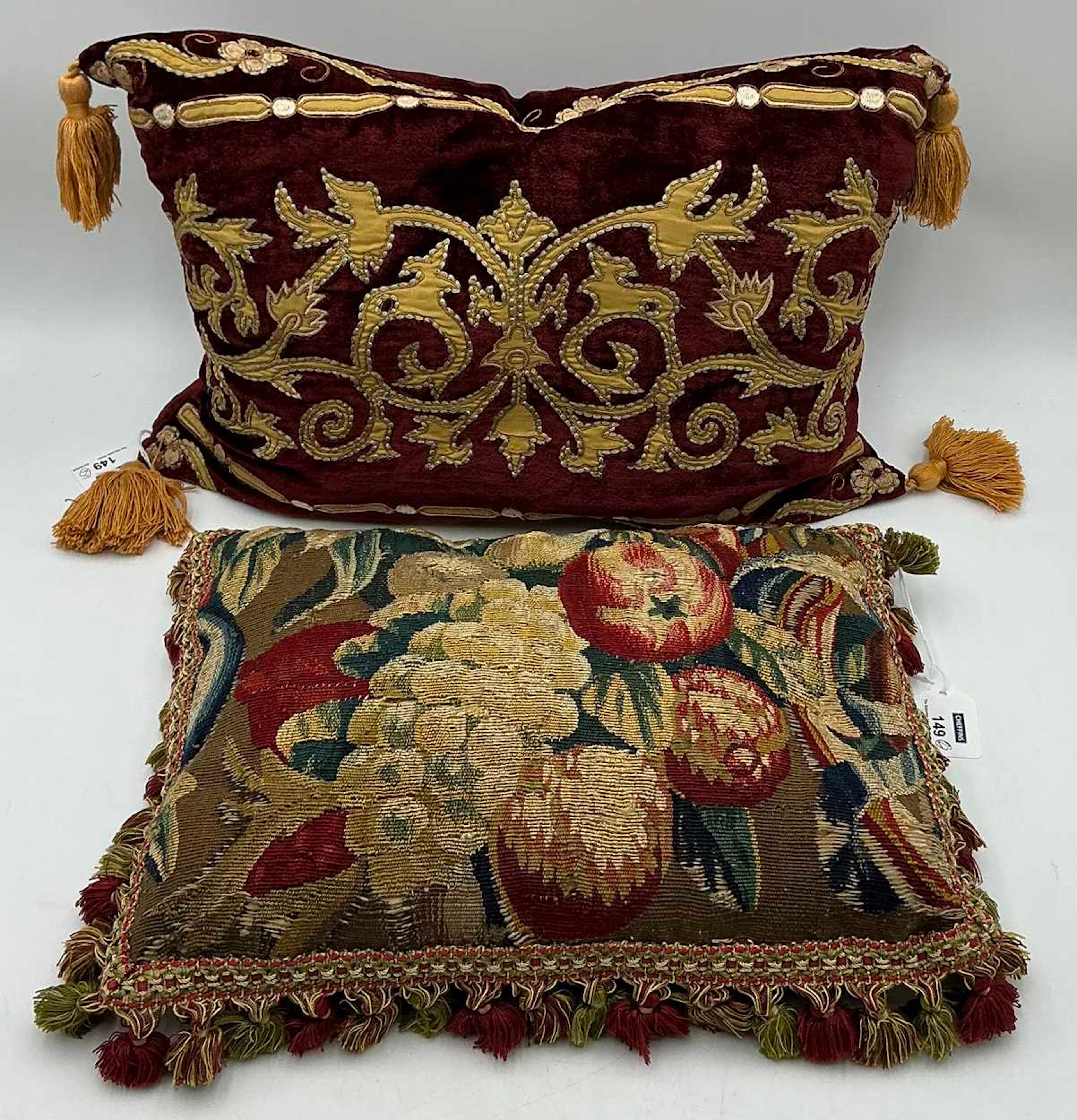 A petitpoint tapestry fragment of flowers and fruit