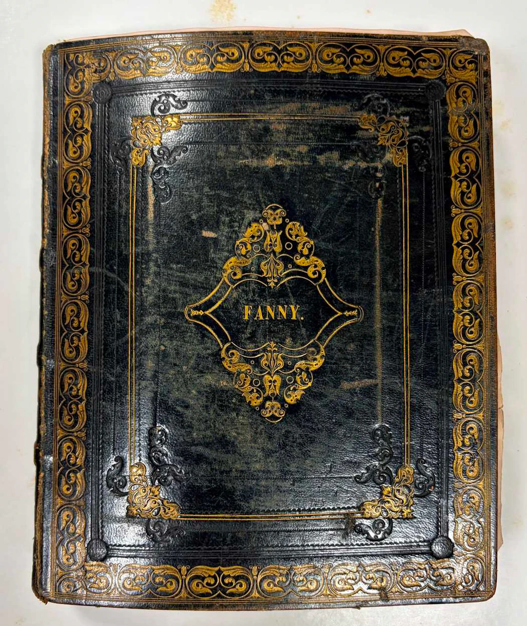 A Regency leather bound and gilt tooled album containing numerous watercolours