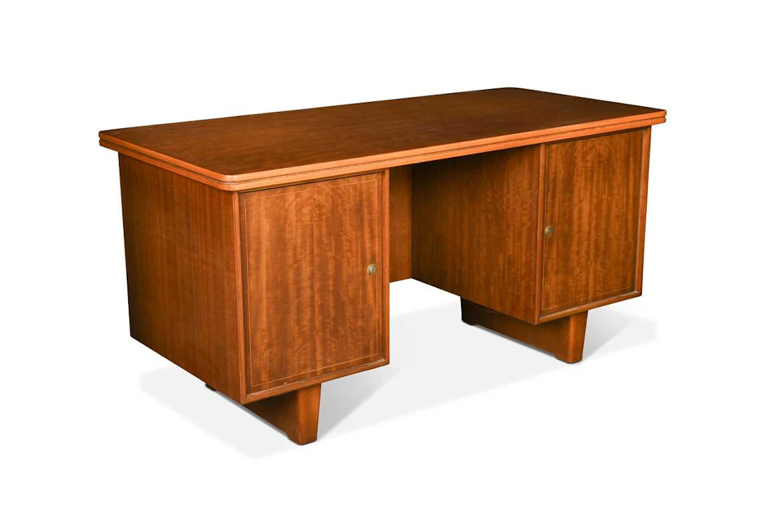 A mid-century satin maple twin-pedestal desk