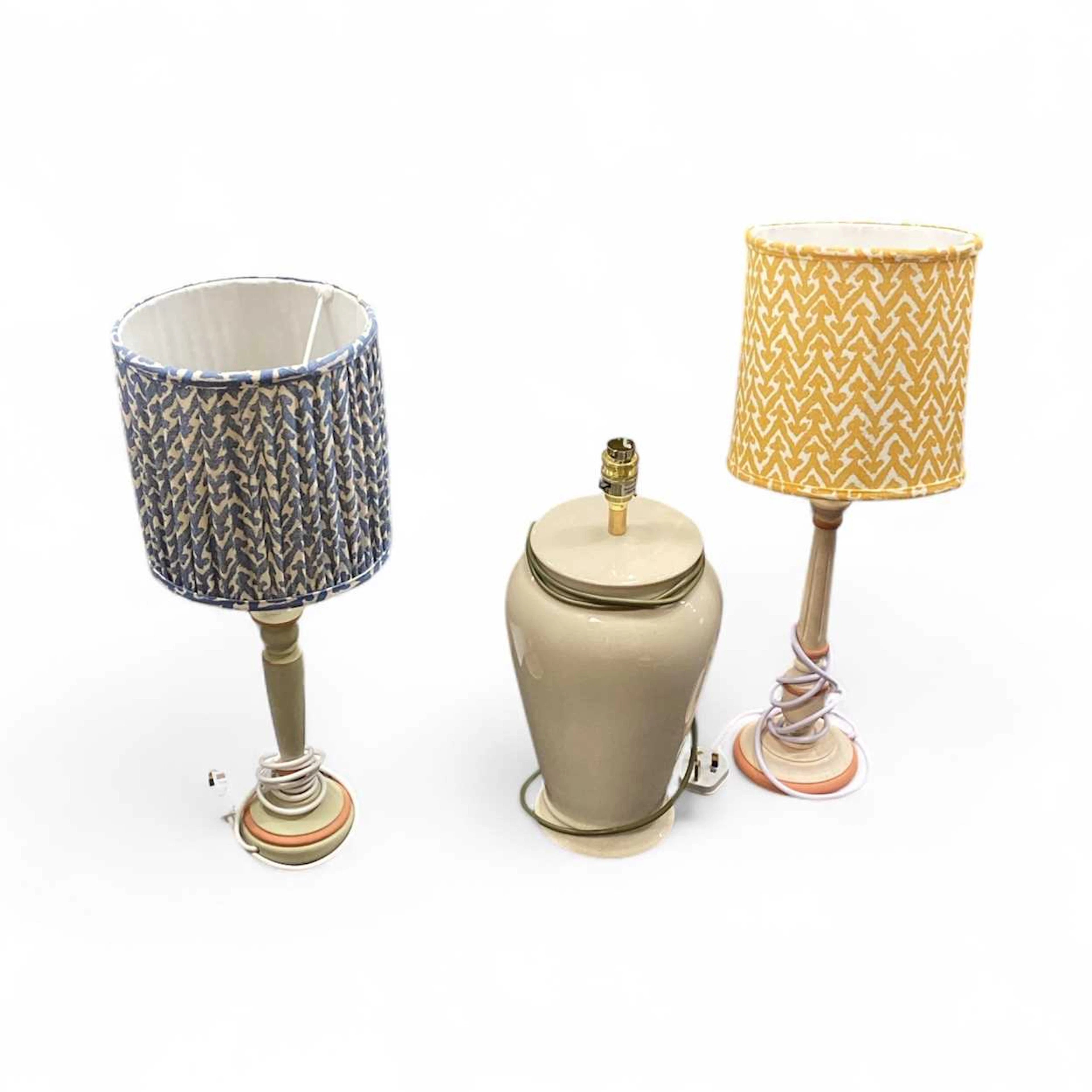 A collection of lamps to include two wooden turned...