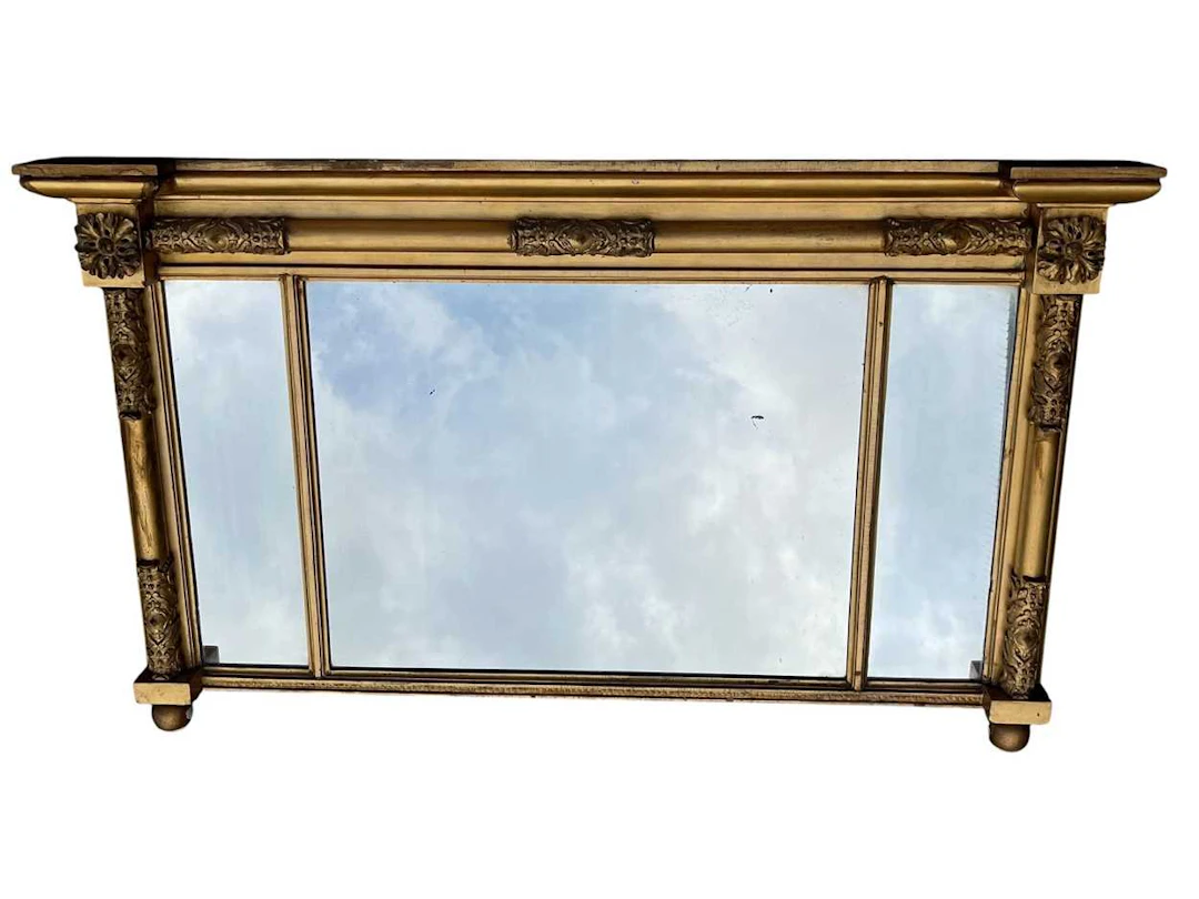 A gilt framed triple plate overmantel mirror