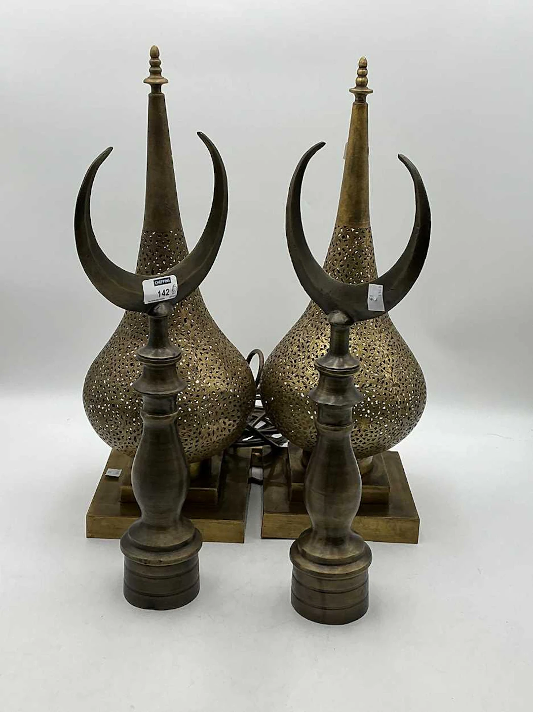 Pair of pierced brass uplights of tear-drop shape