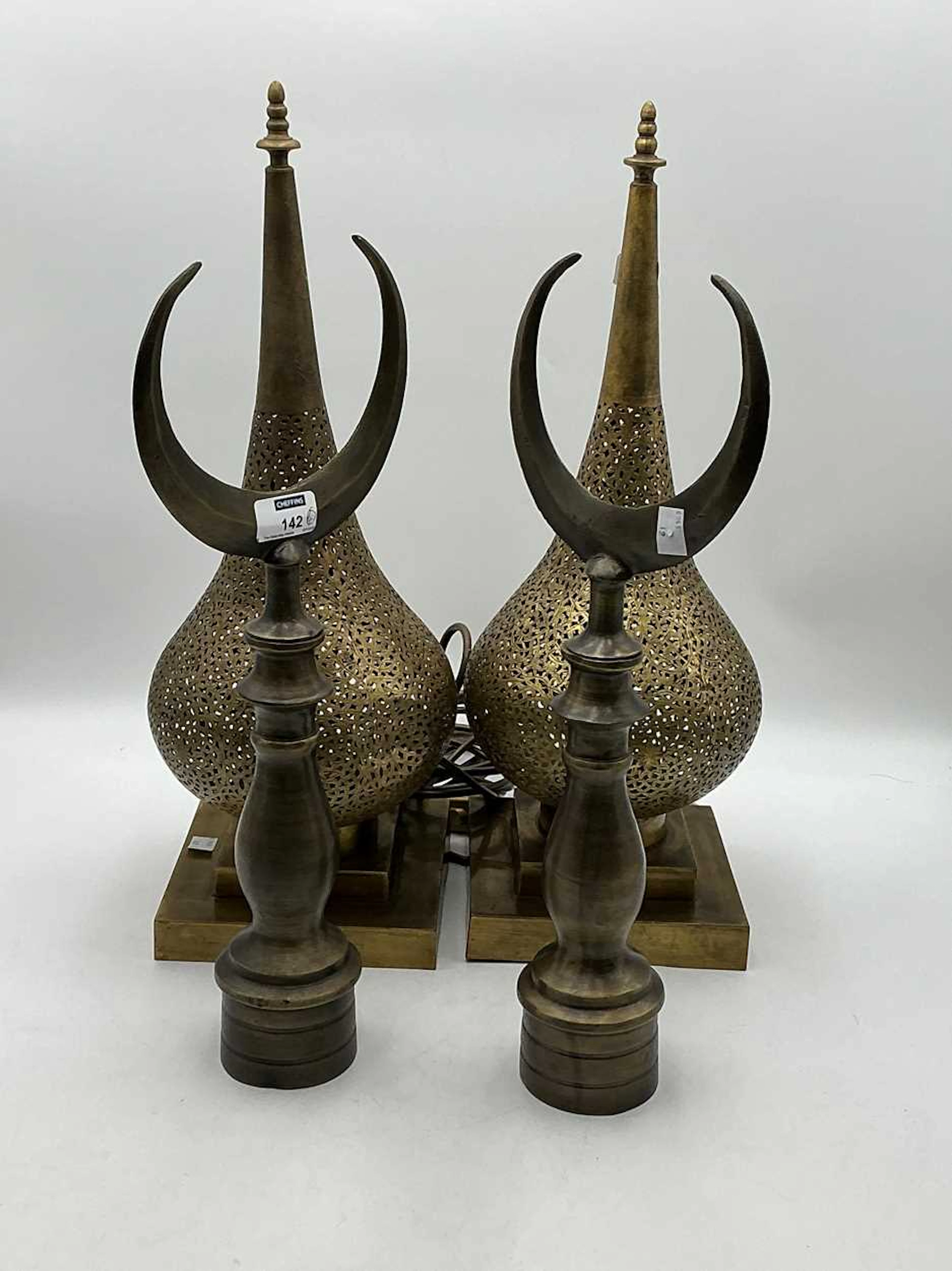 Pair of pierced brass uplights of tear-drop shape