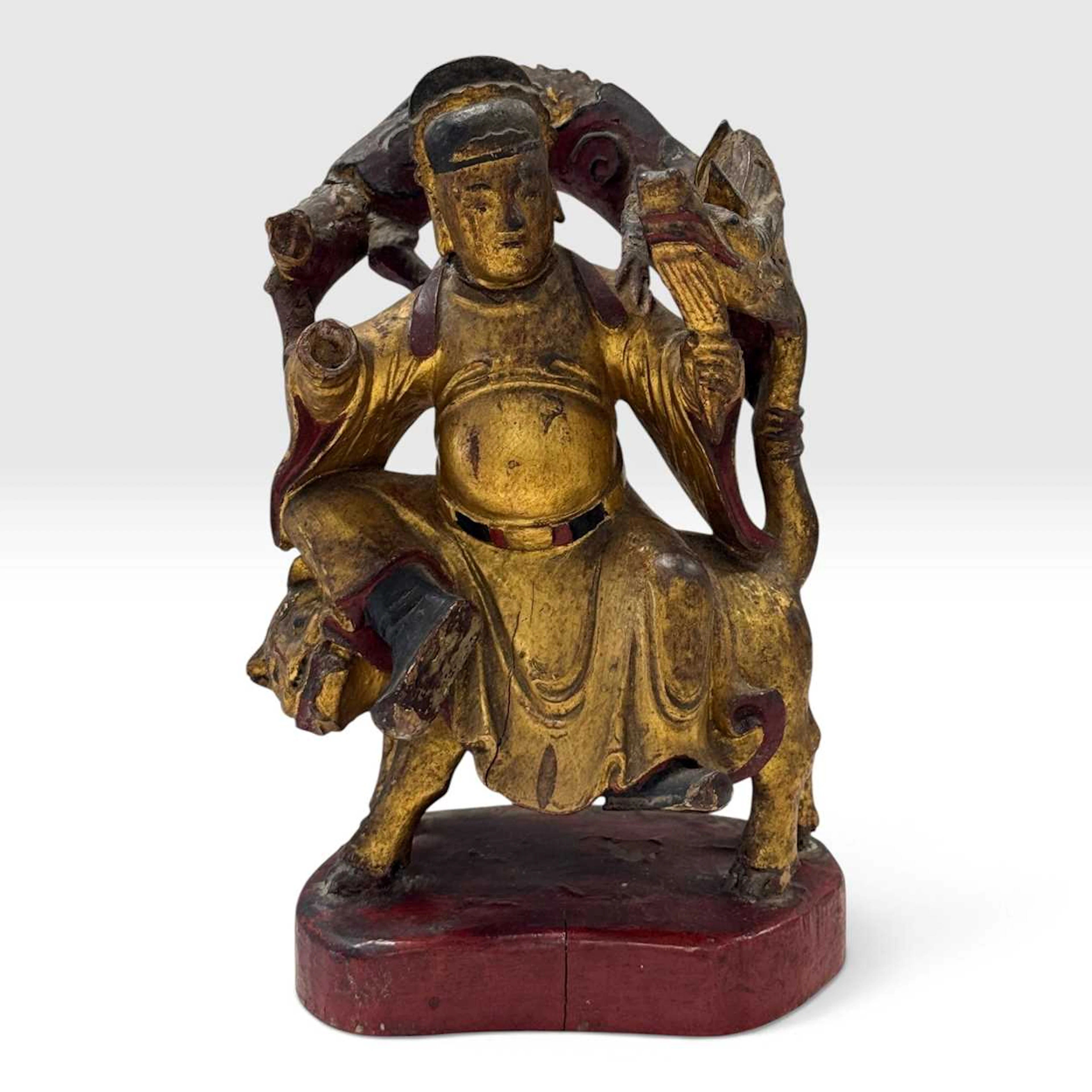 A Chinese carved wooden and gilt figure of a deity, 18th century