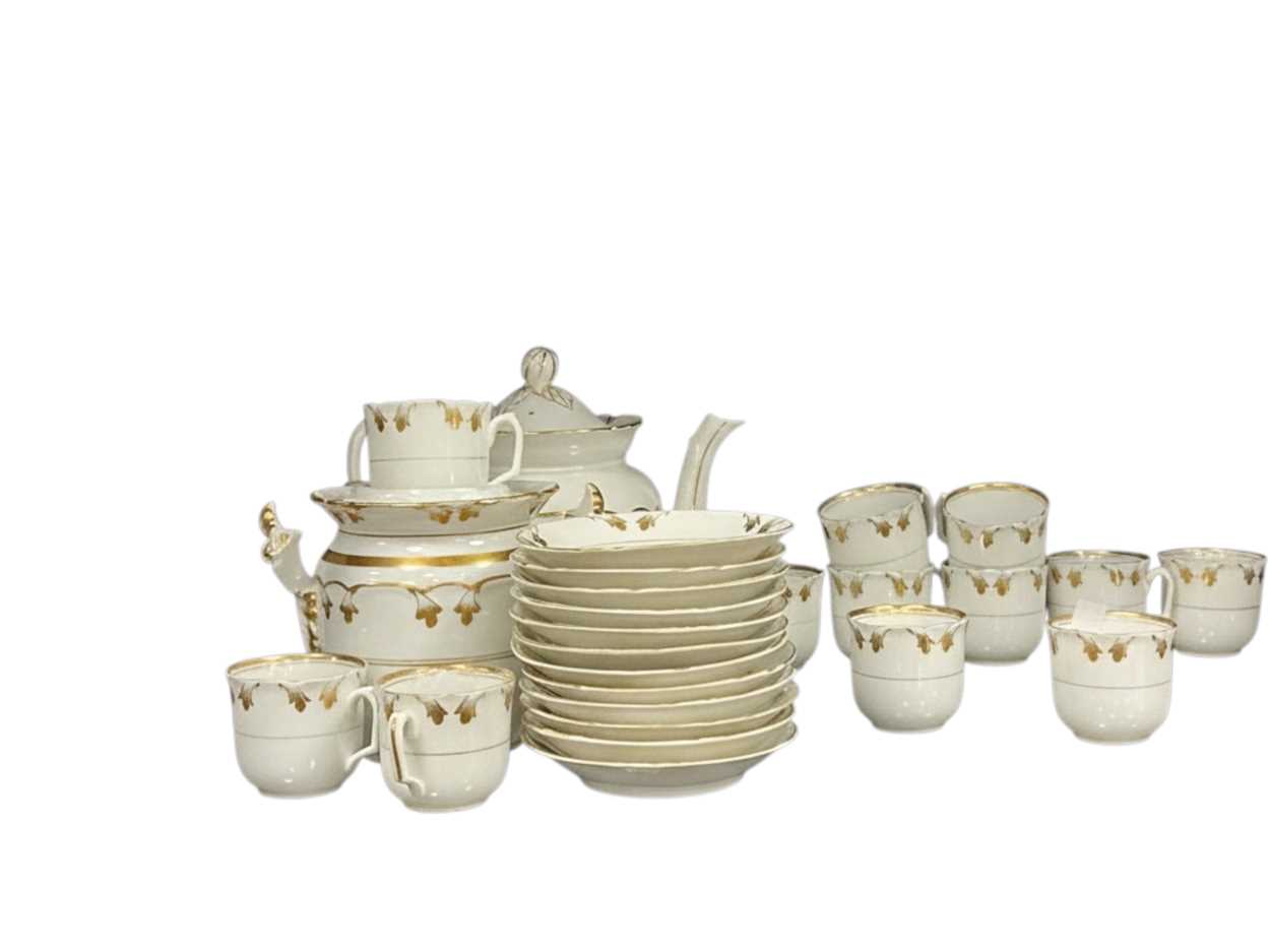 A late 19th century French porcelain coffee set with...