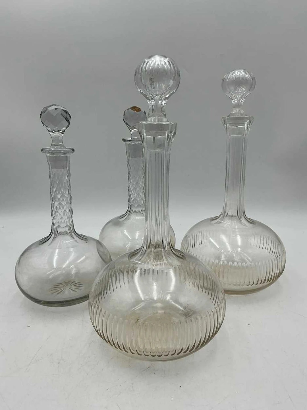 Two pairs of cut glass decanters