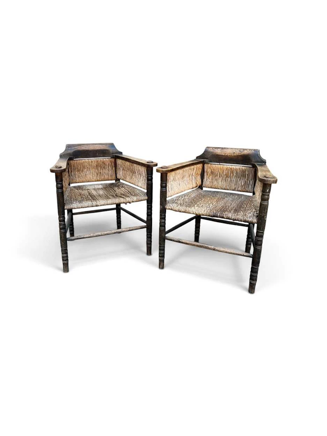 A unusual pair of Arts & Crafts rush seated chairs