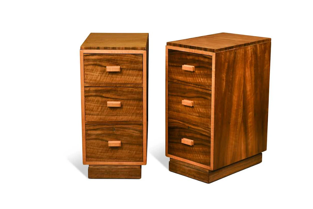 A pair of Art Deco walnut and sycamore bedside chests, circa 1940