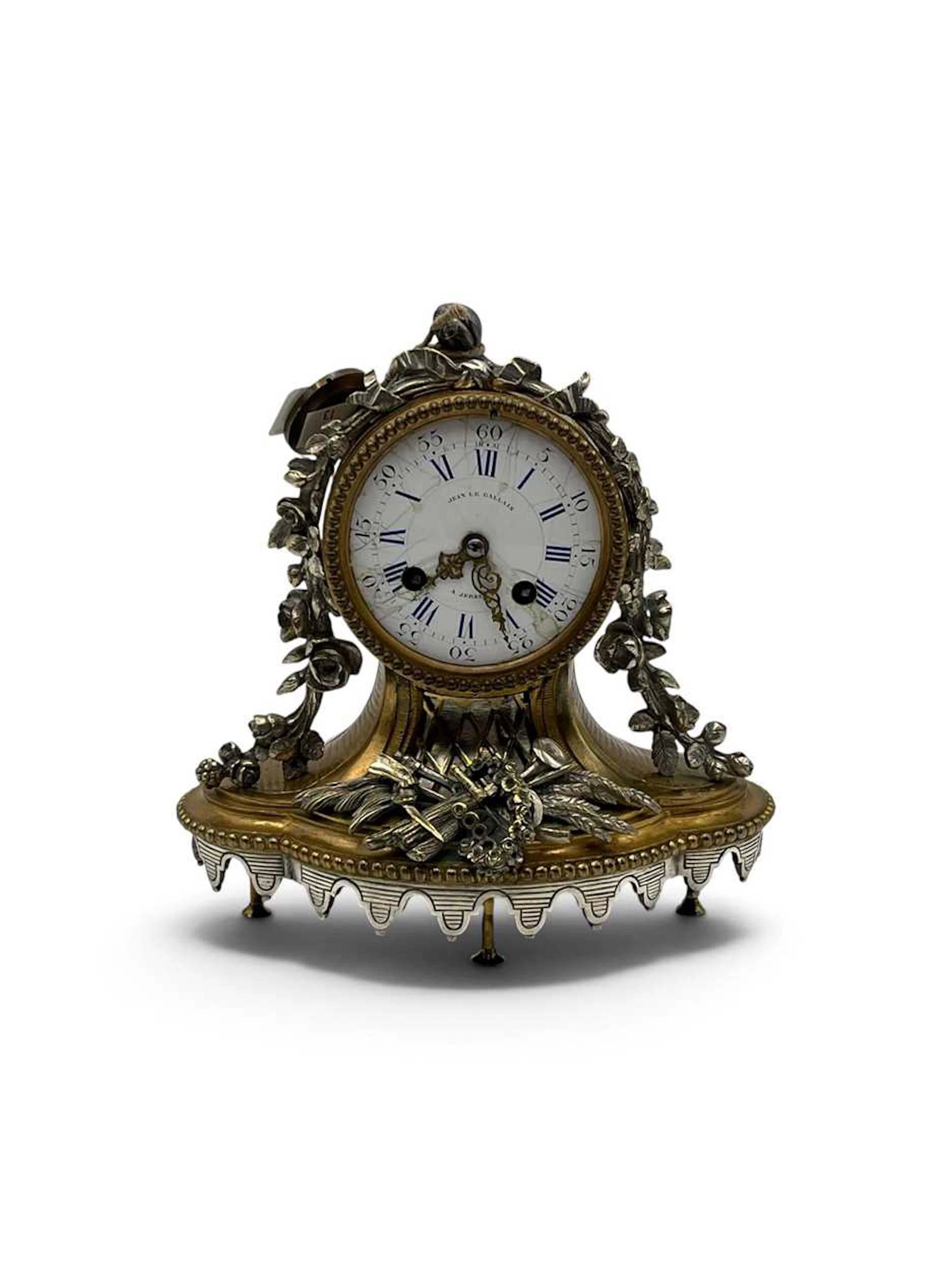 A French ormolu and silver gilt mantel clock