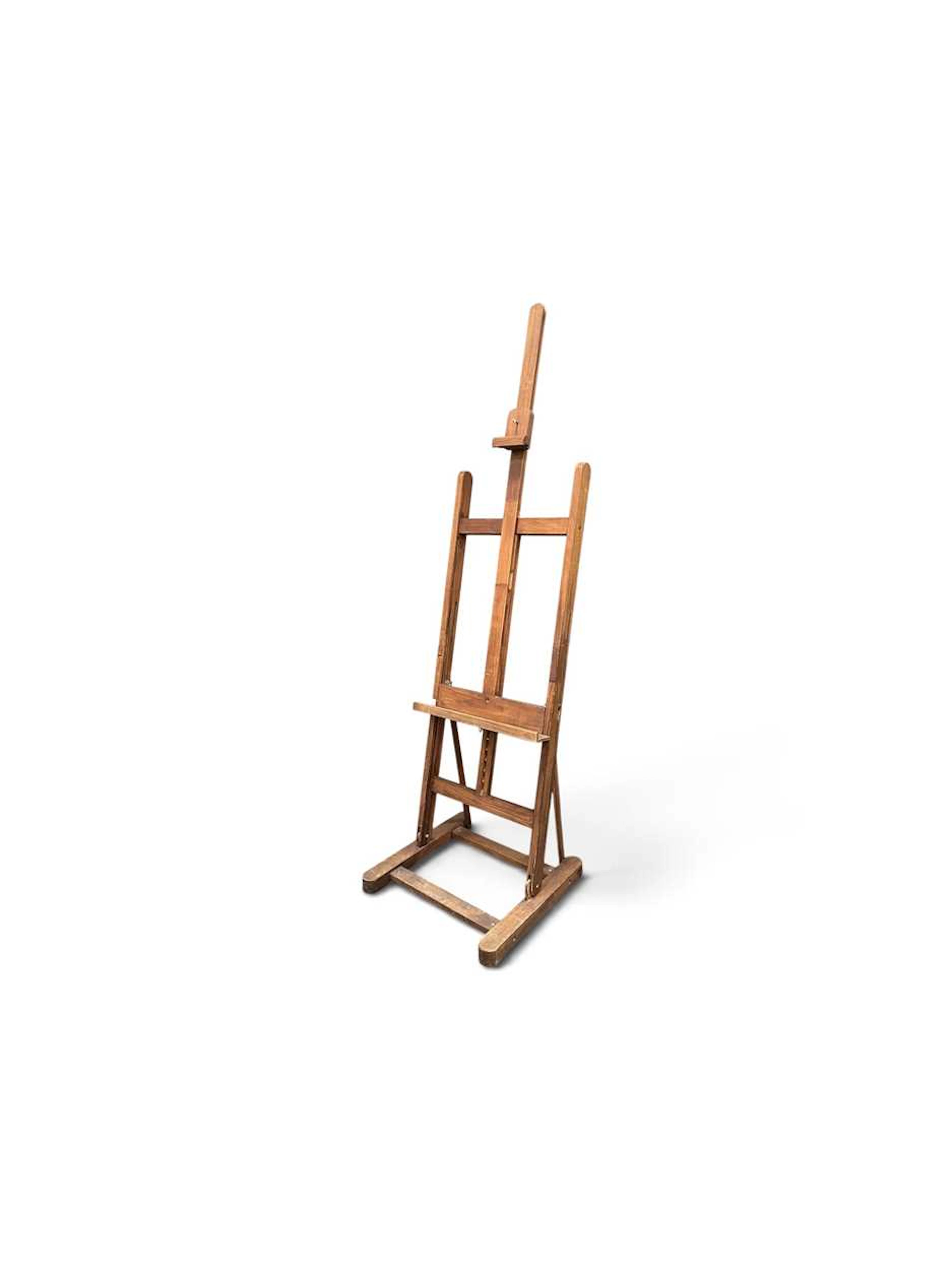 A stained beech adjustable artist easel
