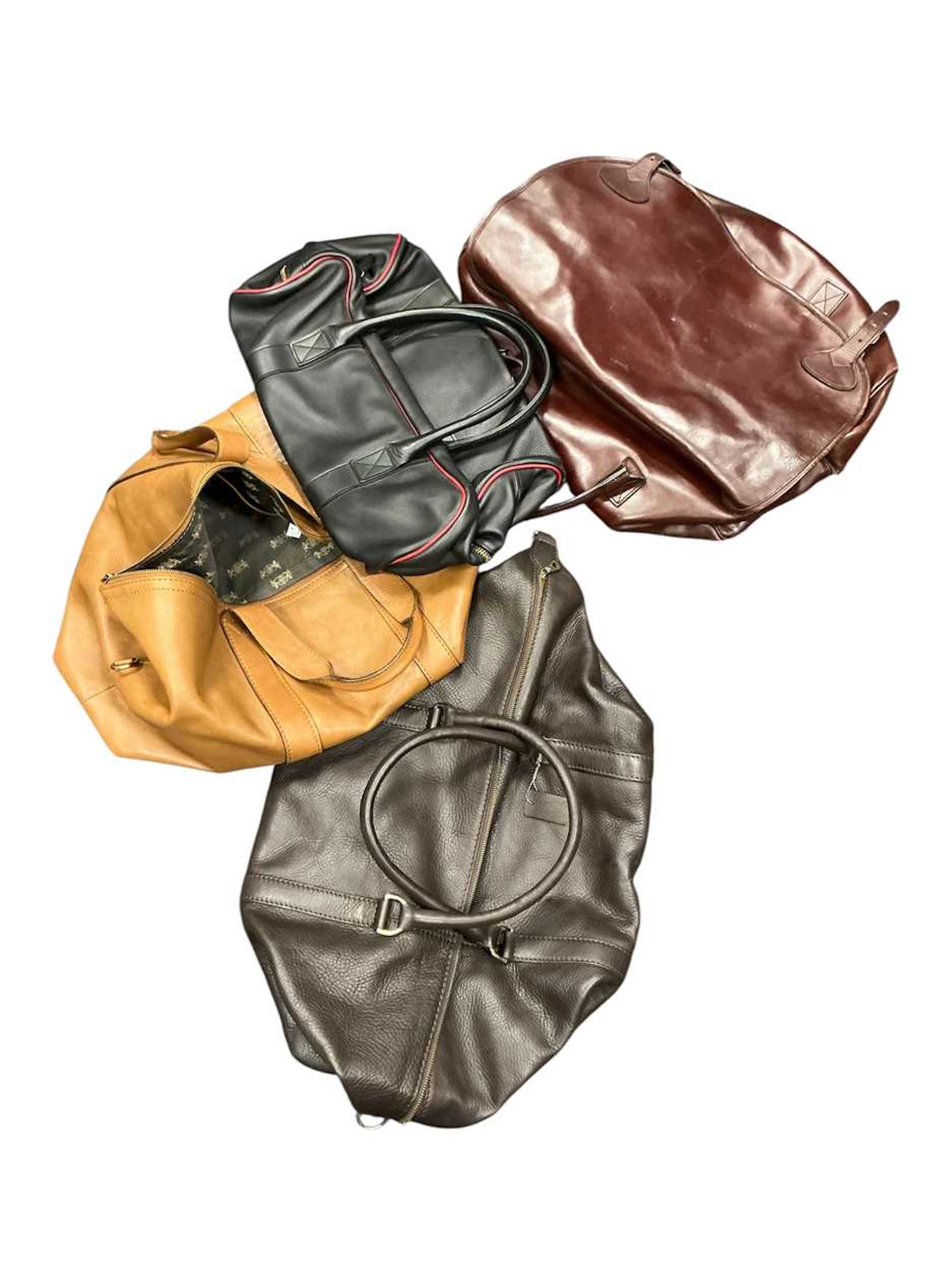 A Swaine Adeney leather holdall and three others