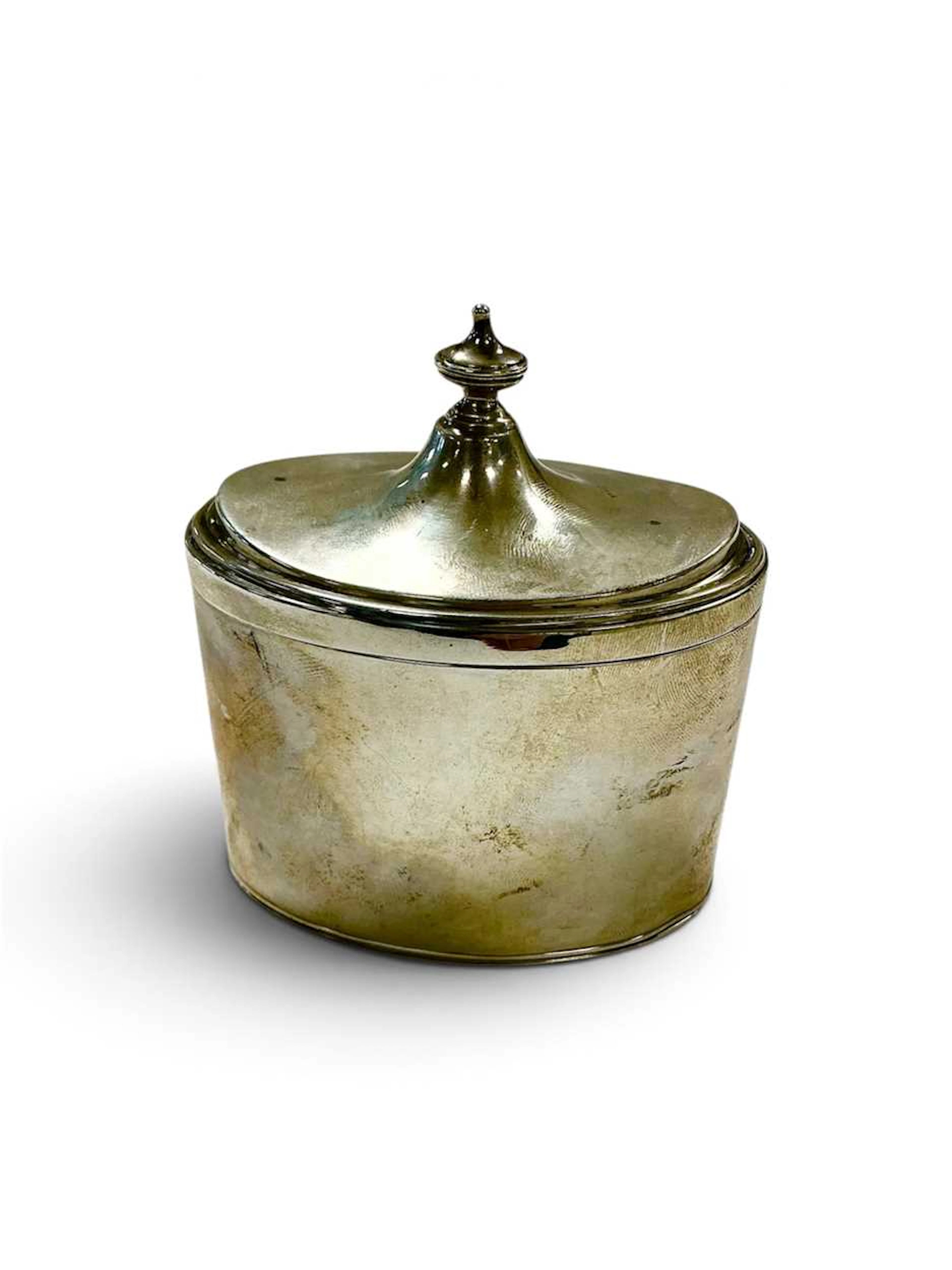 A silver tea canister
