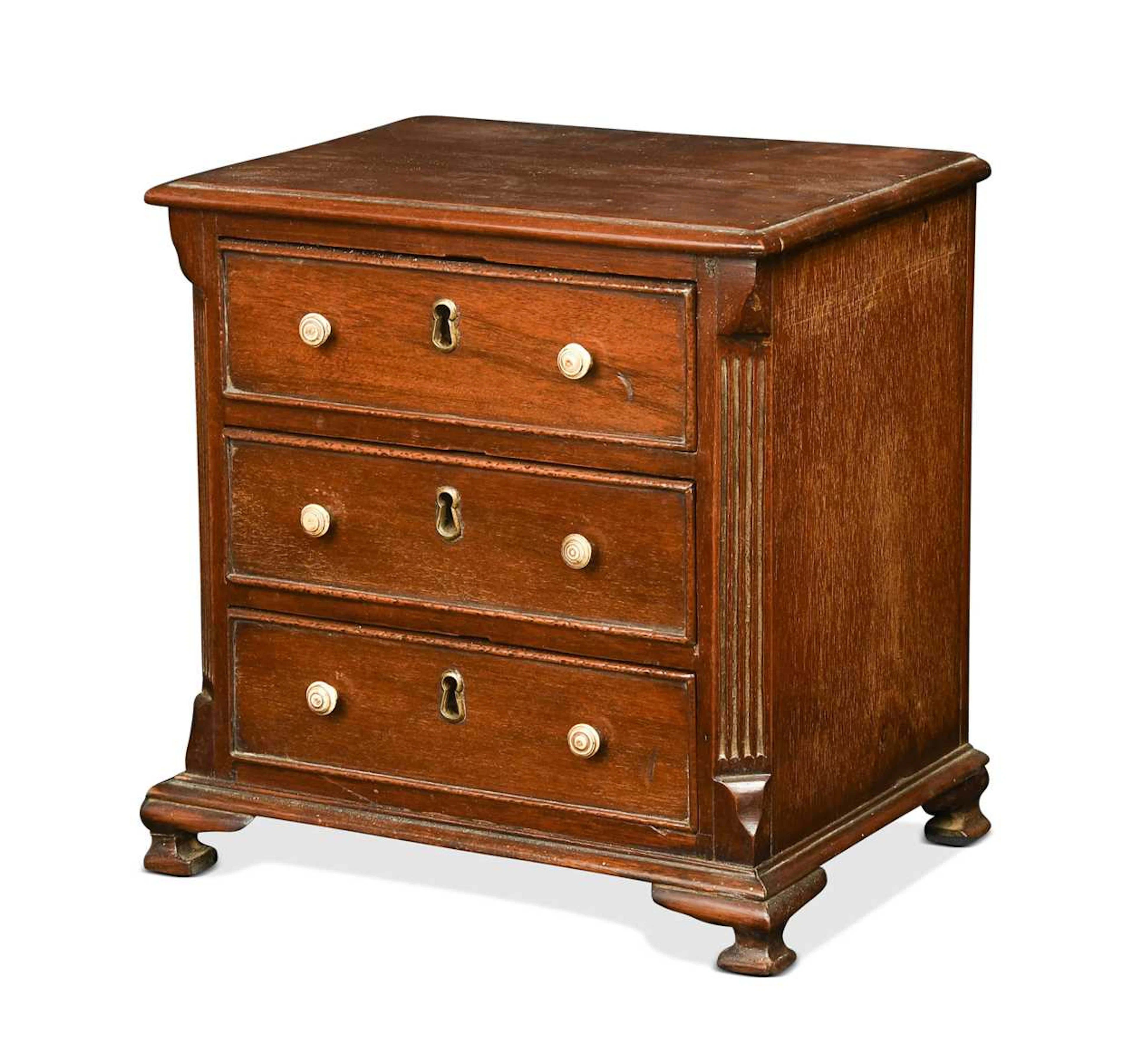 A George III mahogany miniature chest of drawers