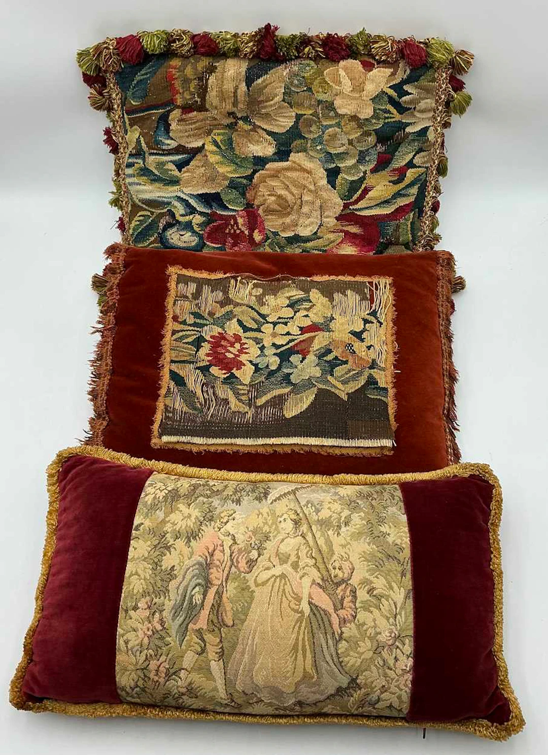 A petitpoint tapestry fragment of roses and fruit