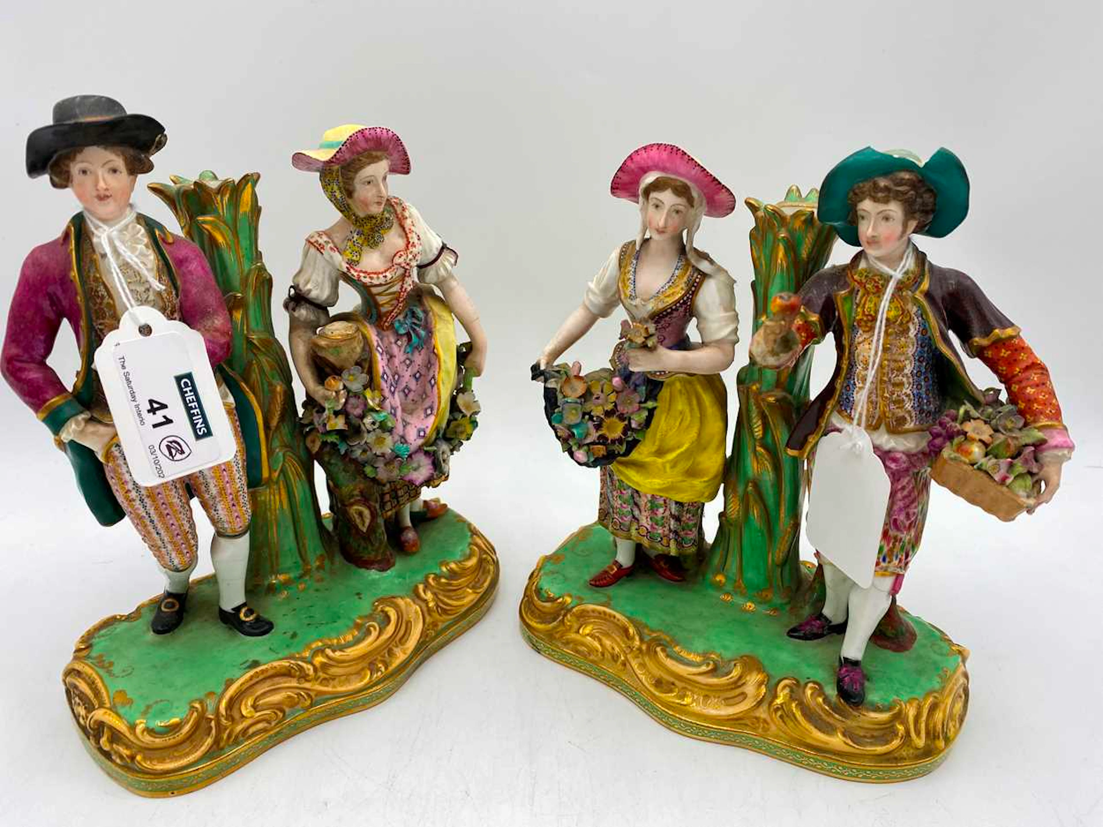 A pair of Victorian Minton figural candle sticks