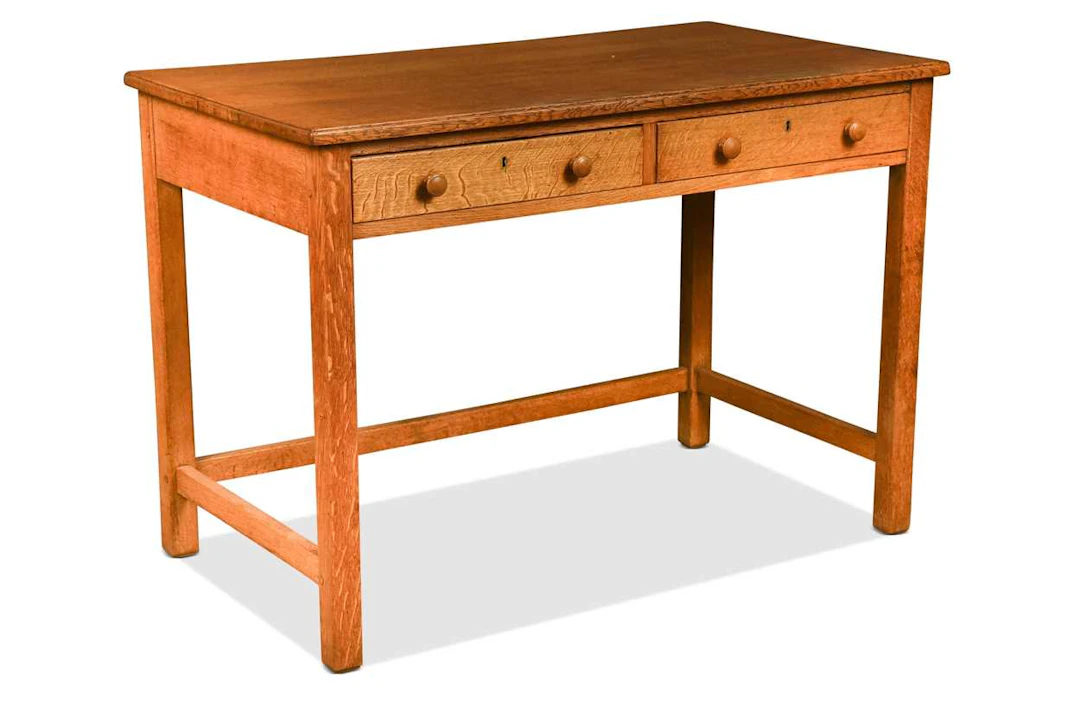 Attributed to Heal's, a Cotswold School oak writing or side table