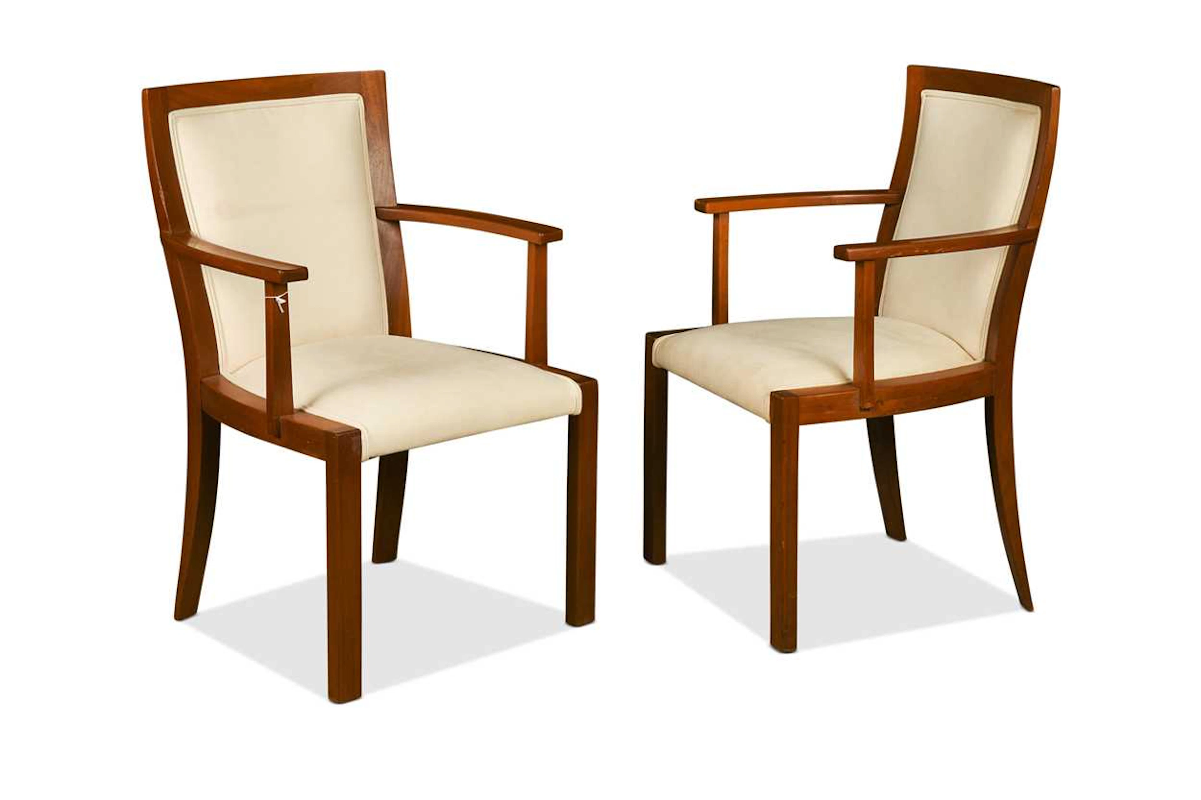 A pair of Art Deco walnut framed elbow chairs