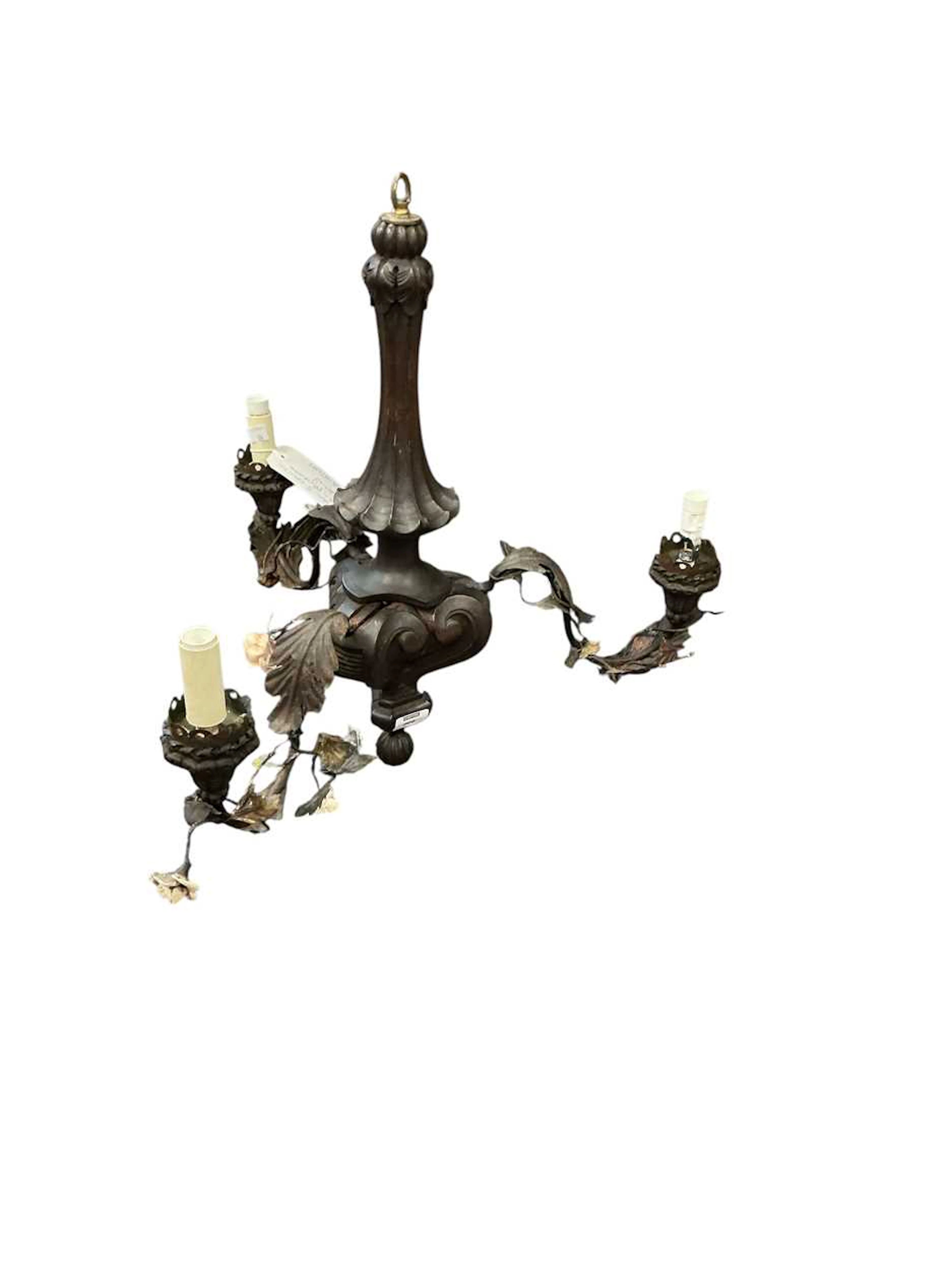 An Italian three-branch wood and painted tole chandelier