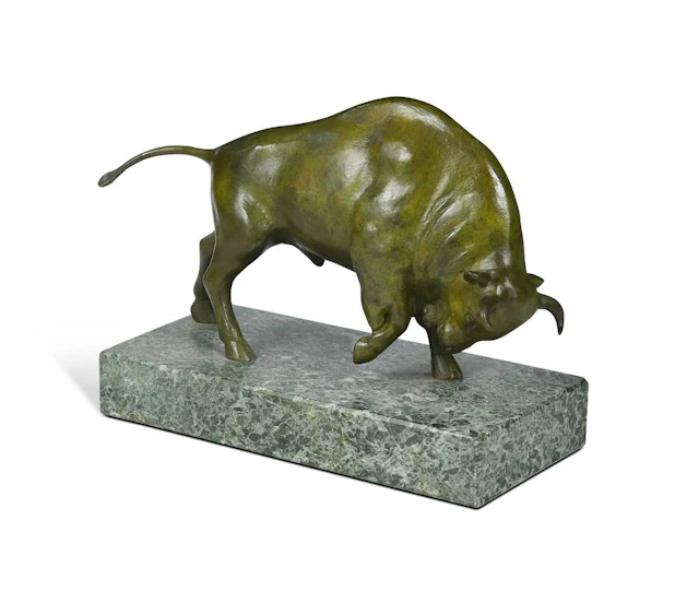 A patinated bronze Art Deco model of a charging bull, 20th century