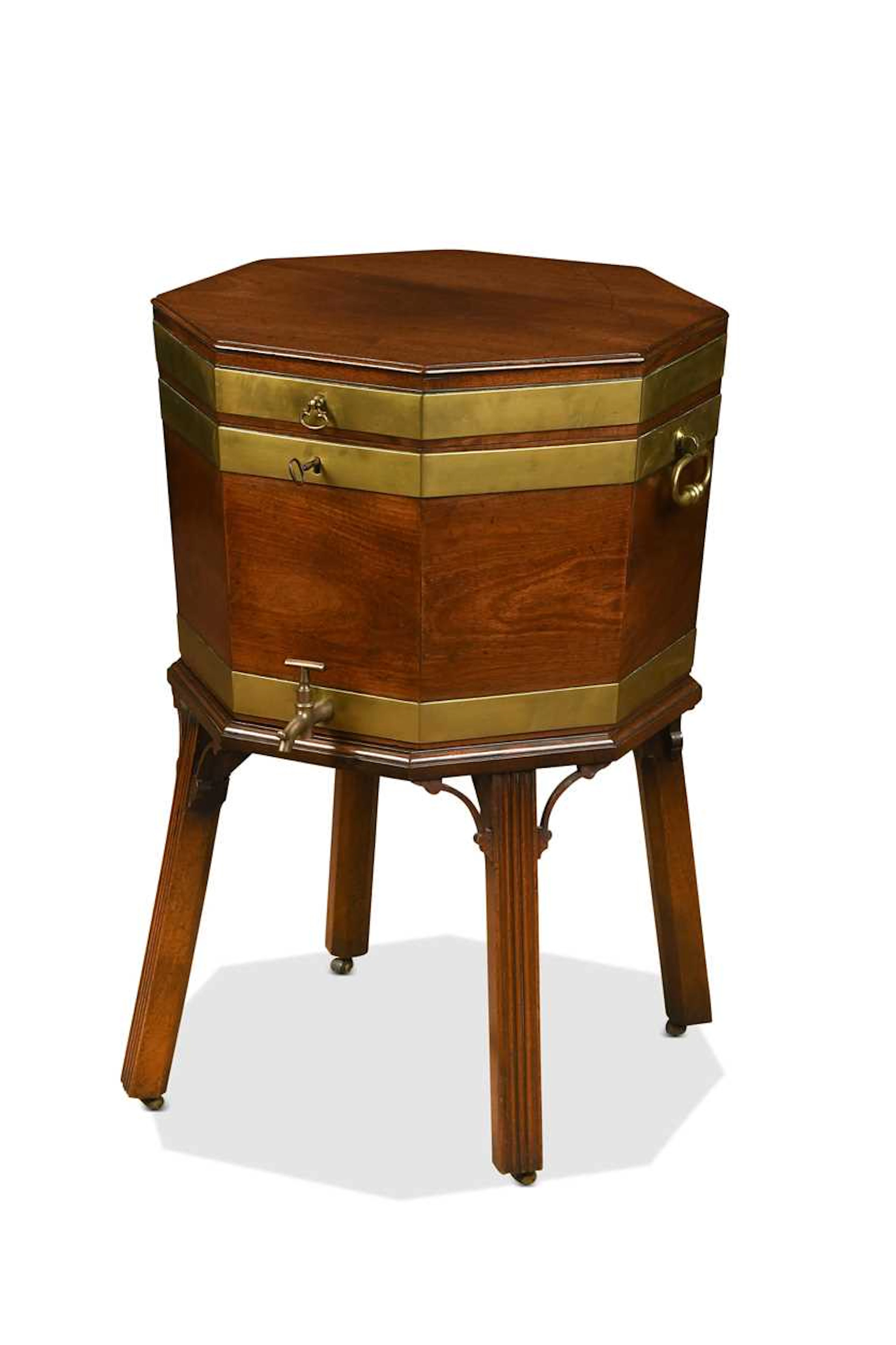 A George III mahogany and brass-bound octagonal cellaret on stand