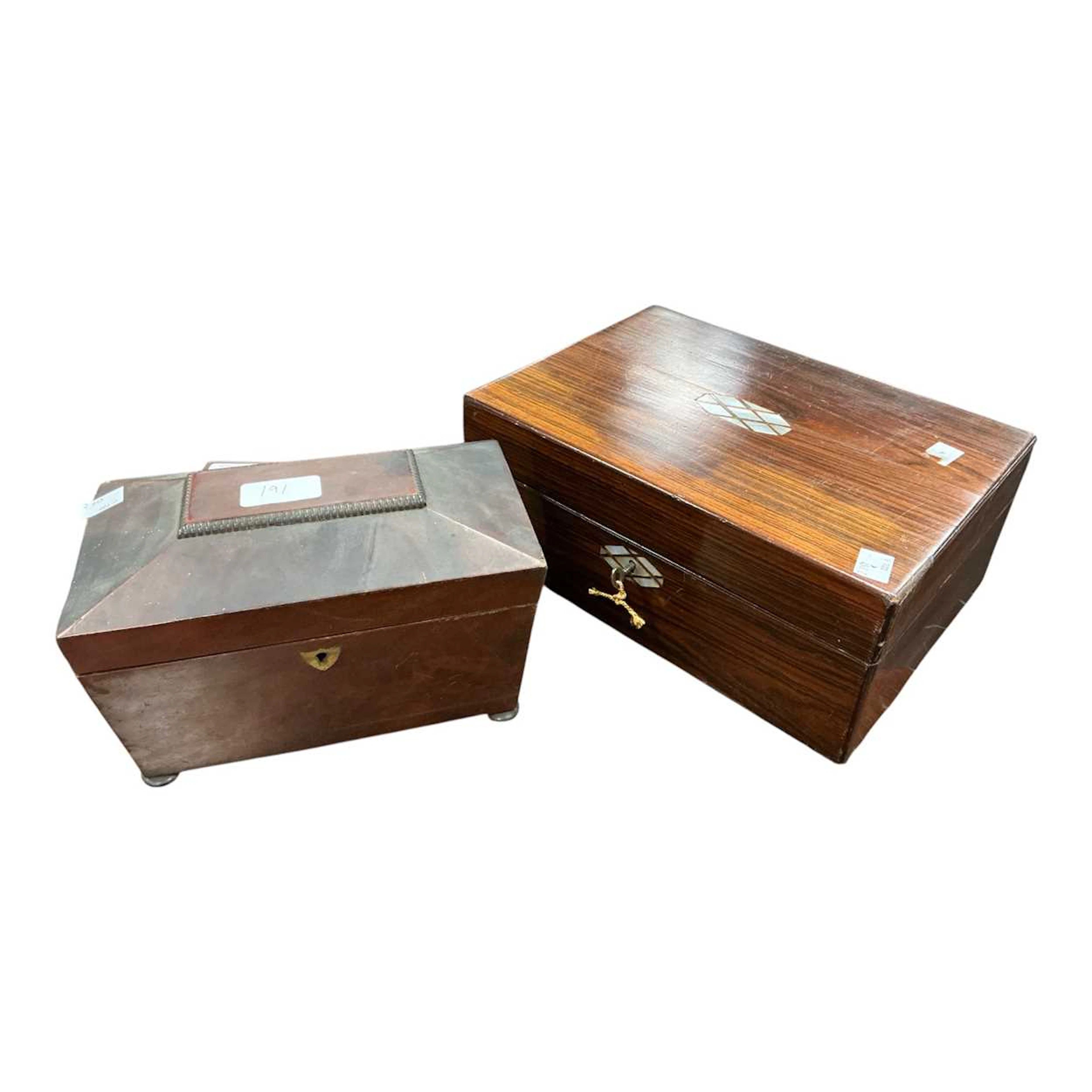 A faux rosewood jewellery box with mother of pearl inset to the lid