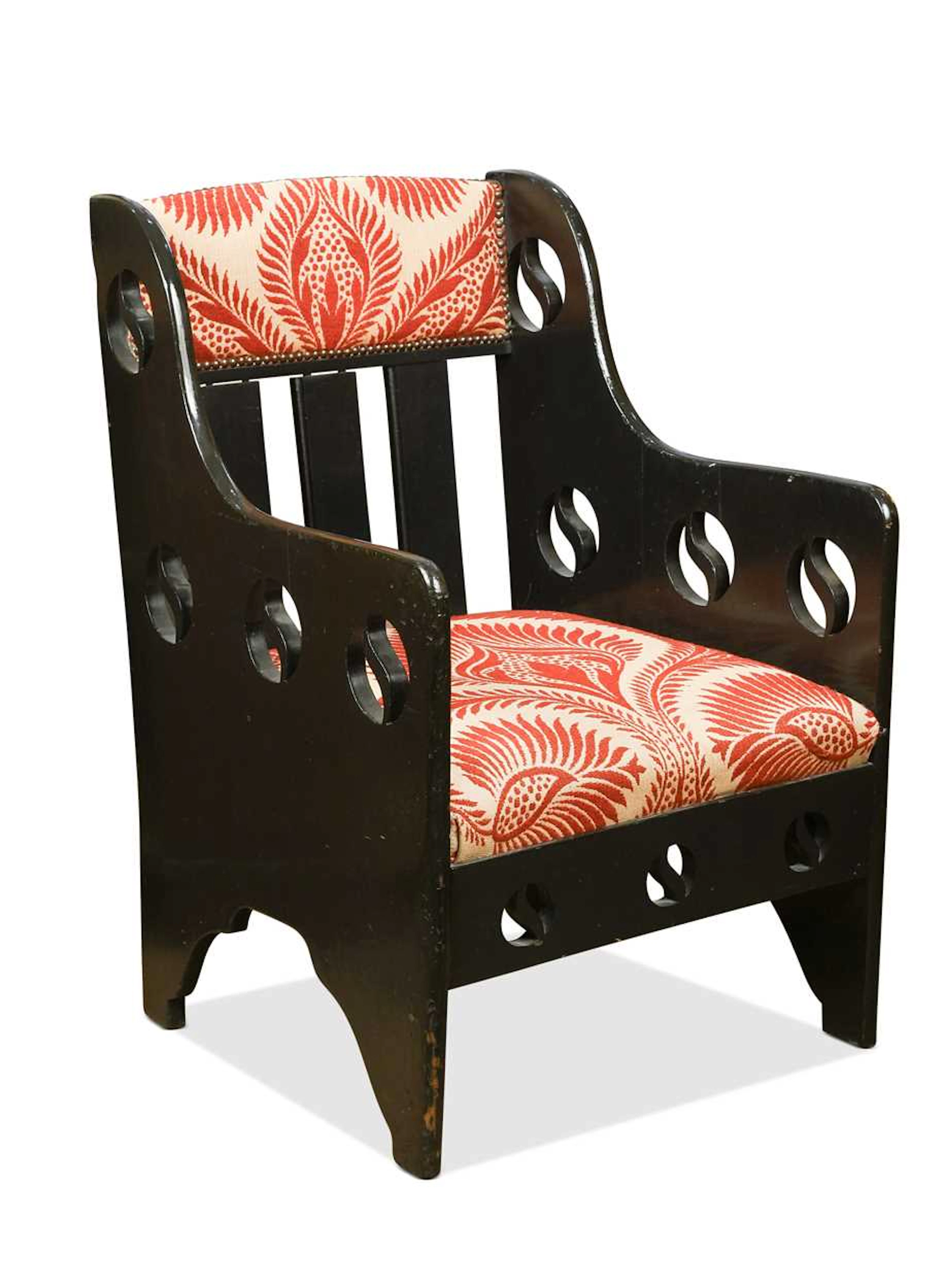 An ebonised Arts & Crafts armchair, probably retailed by Goodyers of London