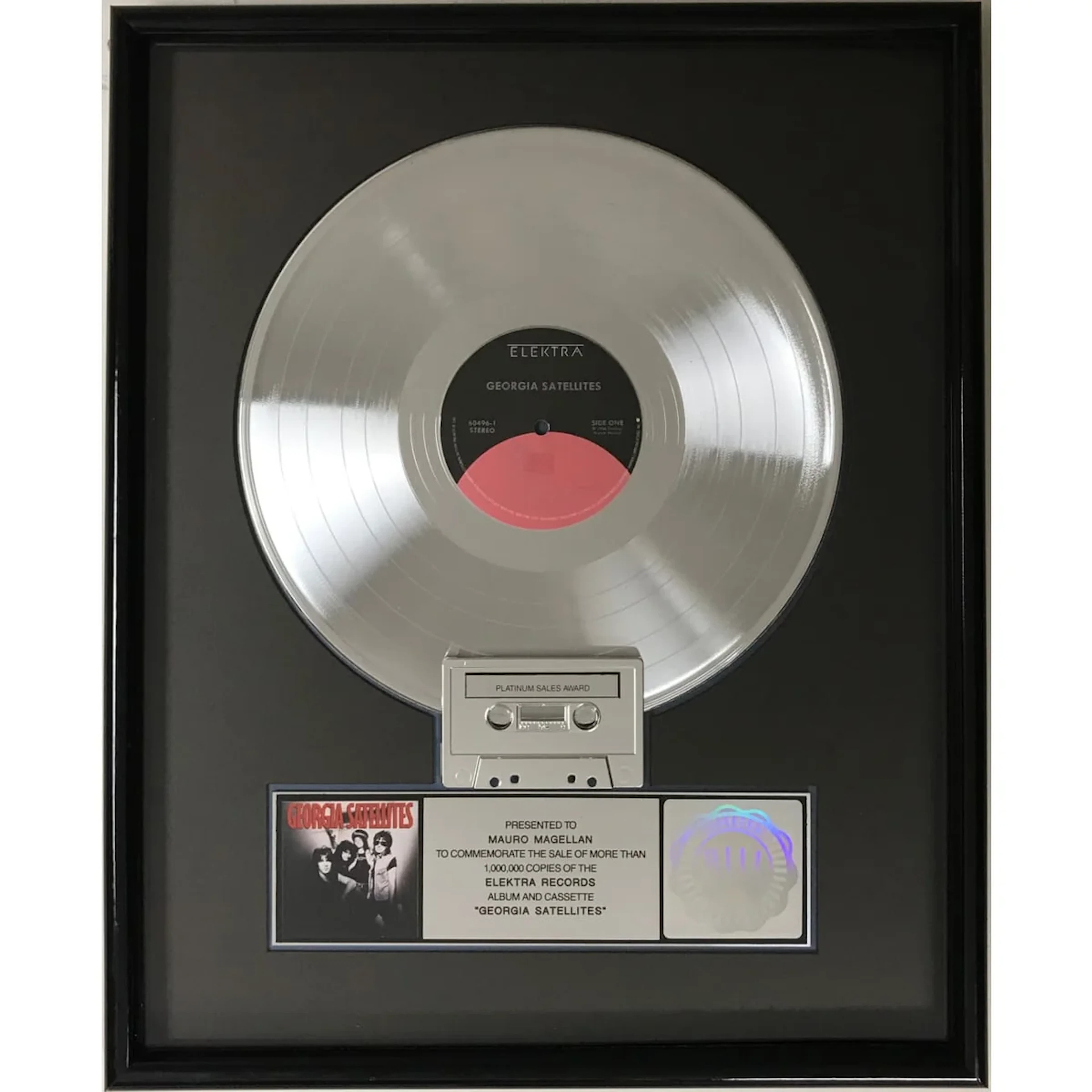 Georgia Satellites debut RIAA Platinum LP Award presented to group's drummer