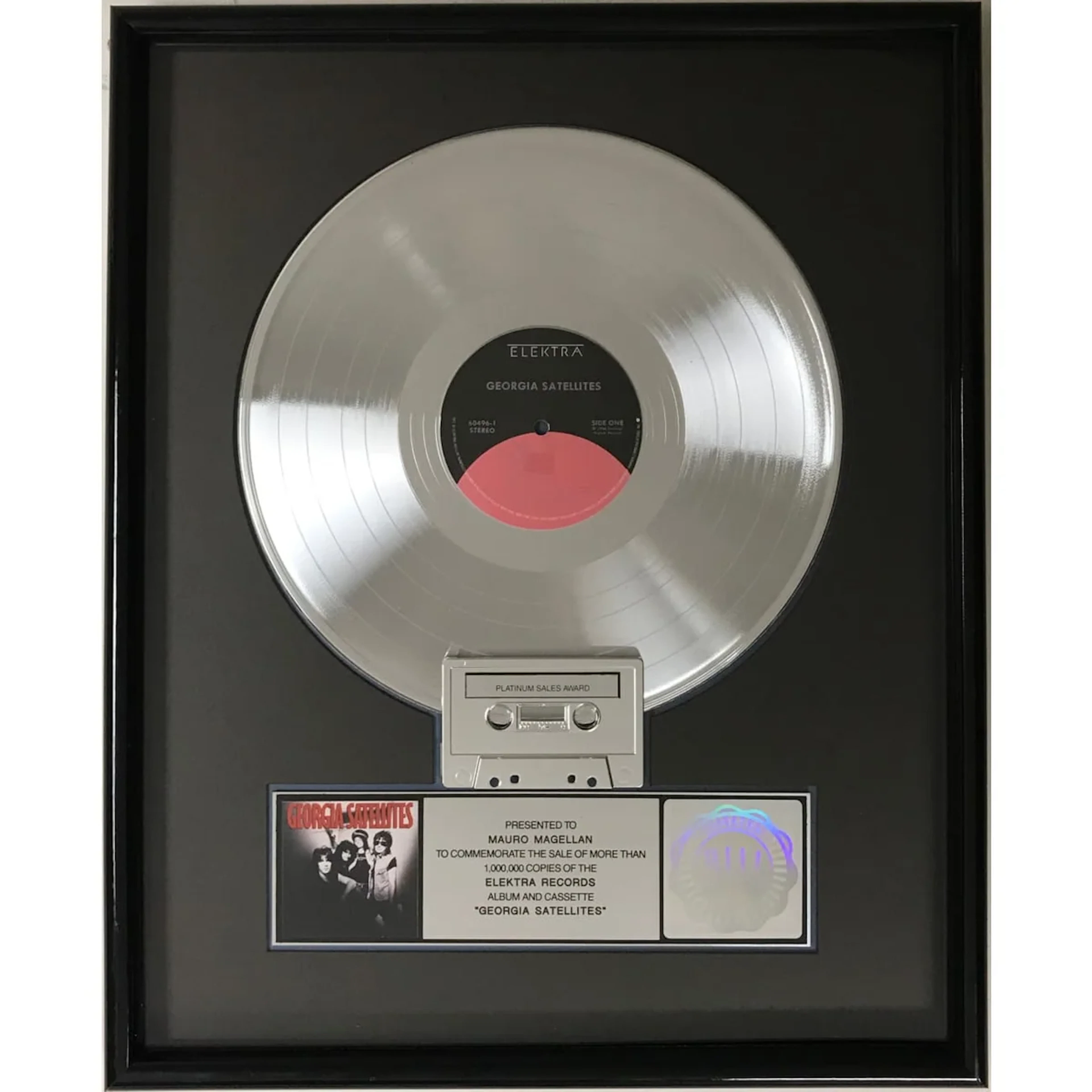 Georgia Satellites debut RIAA Platinum LP Award presented to group's drummer