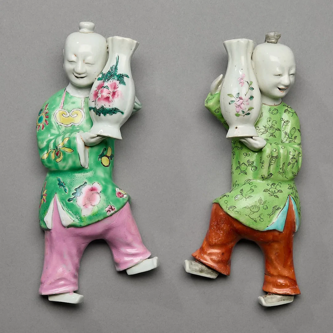 2 Figural Smiling Boy Wall Pockets