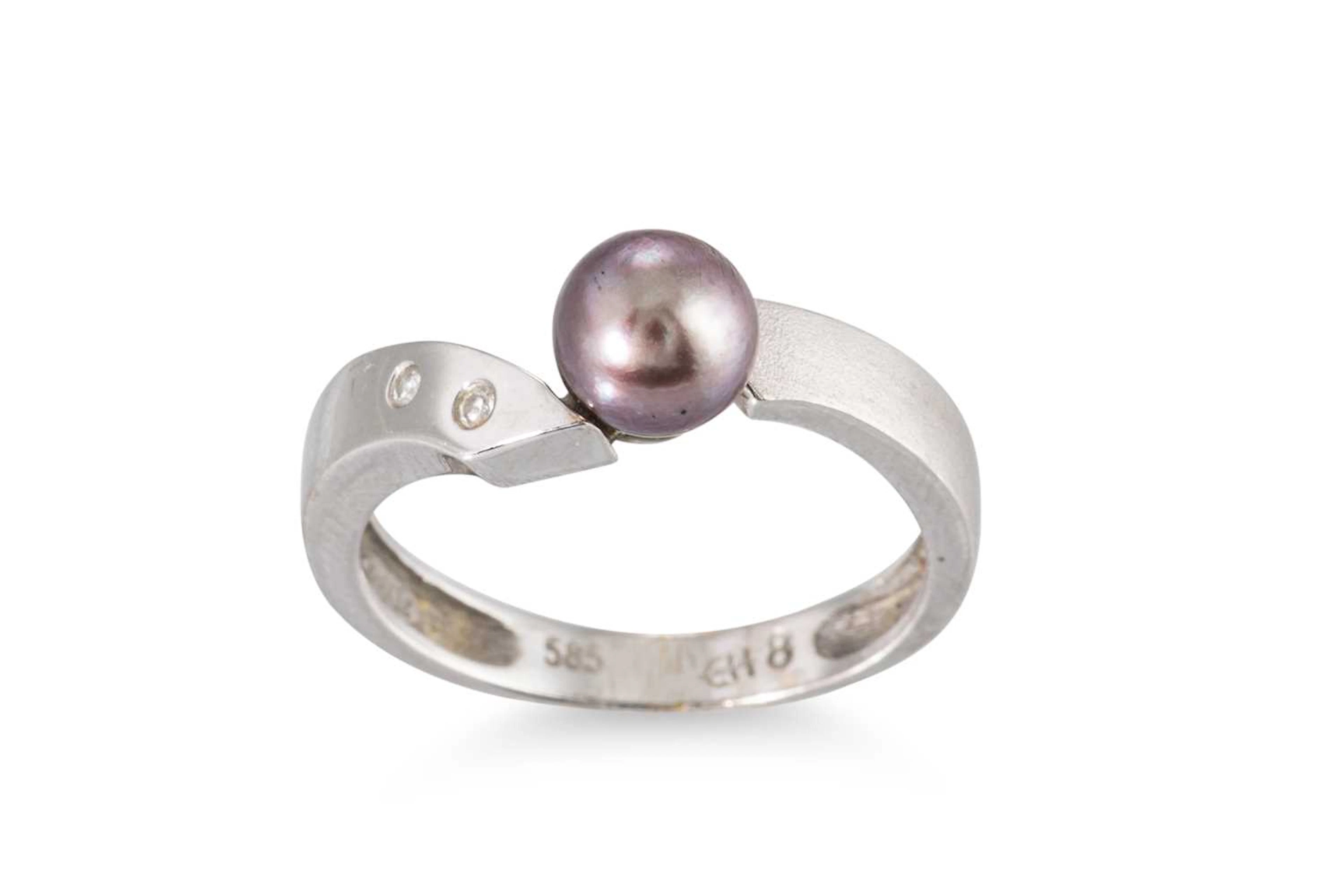 A CULTURED PEARL AND DIAMOND SET RING
