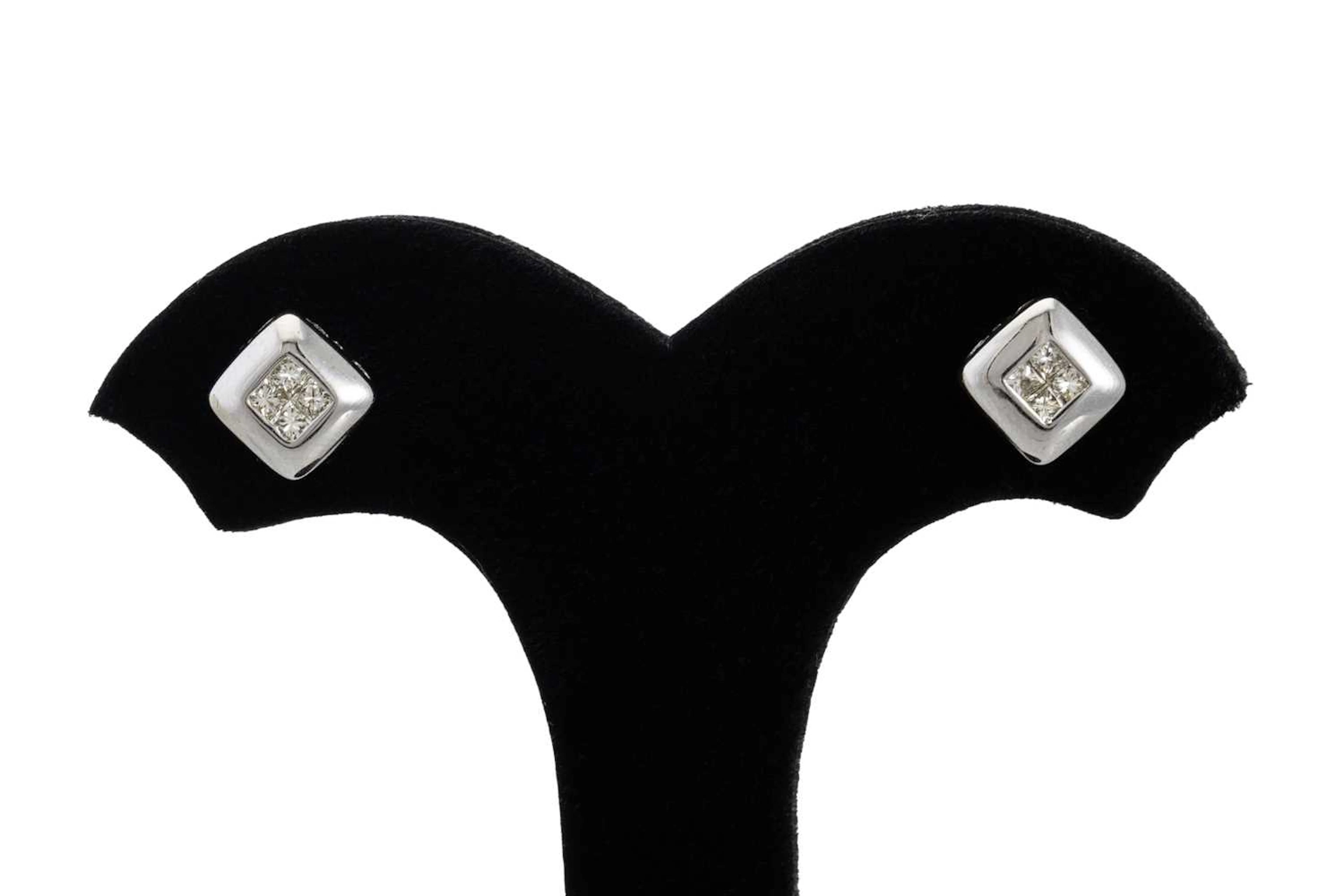 A PAIR OF DIAMOND CLUSTER EARRINGS