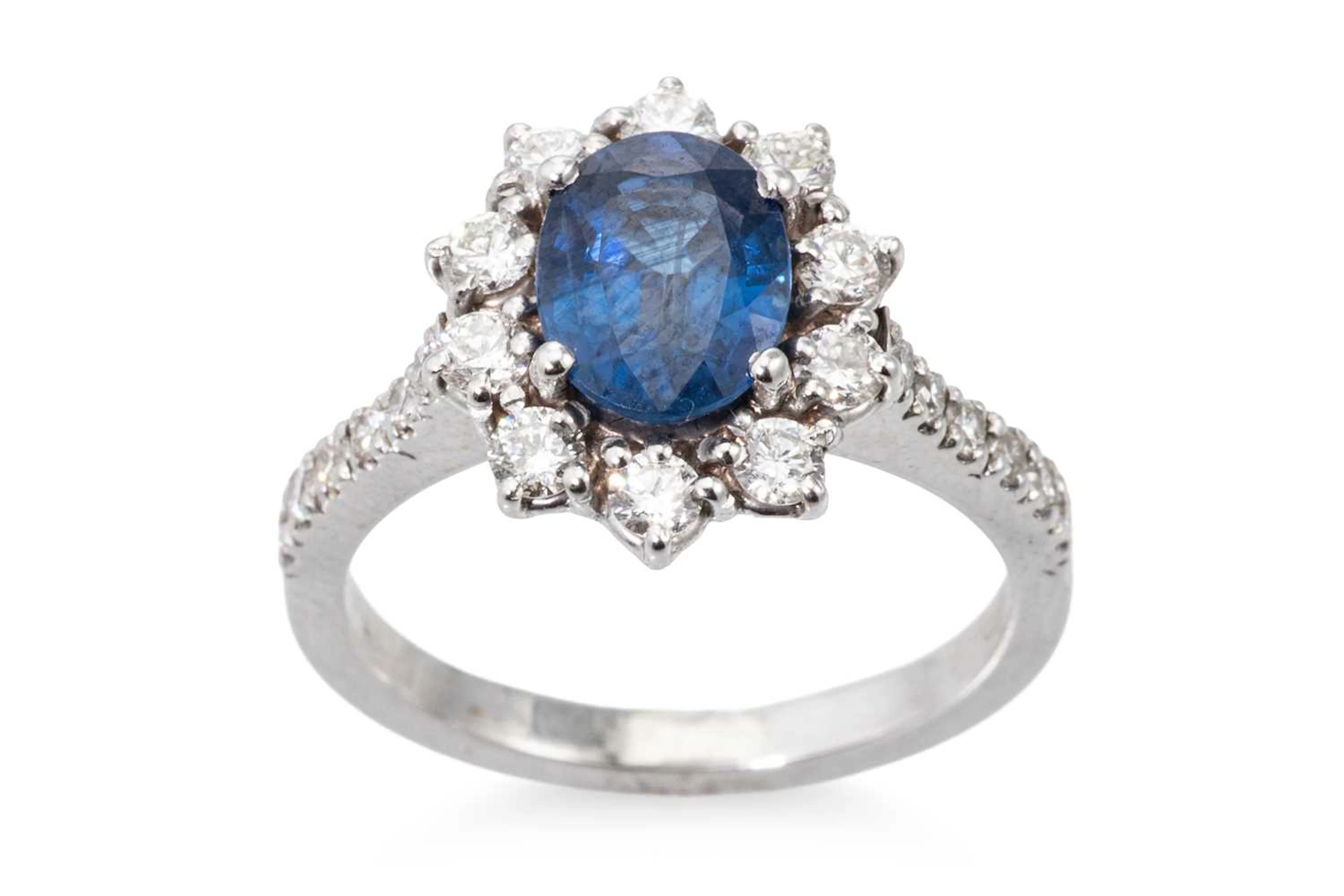 A SAPPHIRE AND DIAMOND CLUSTER RING