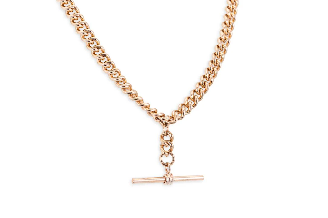 A 9CT ROSE GOLD DOUBLE ALBERT CHAIN